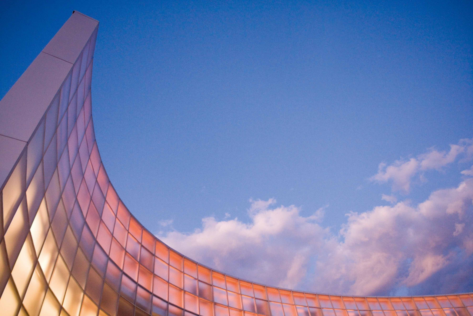 A view of the curved wall at sunset