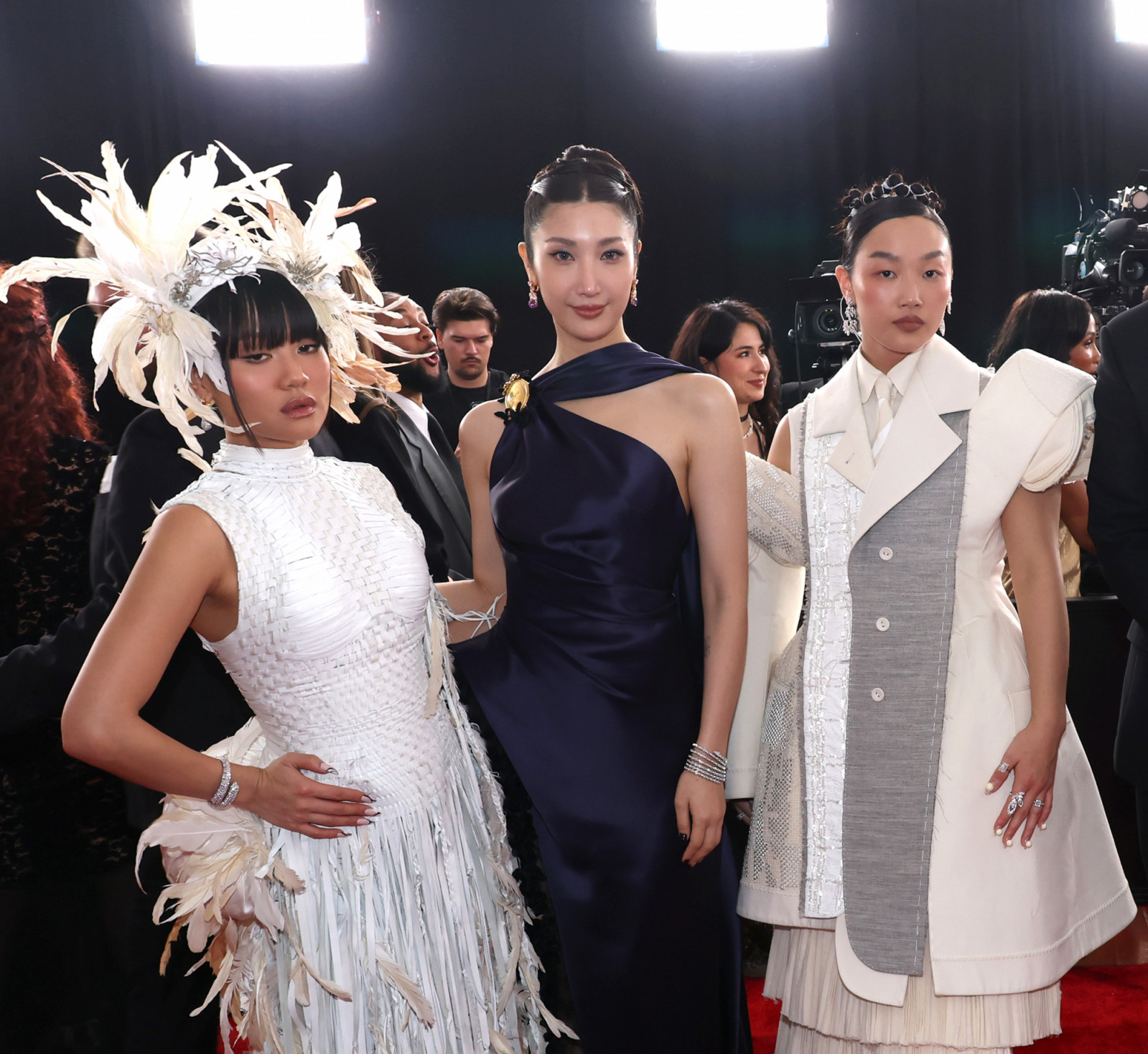LOS ANGELES, CALIFORNIA - FEBRUARY 01: (L-R) Rei Ami, EJAE, and Audrey Nuna of HUNTR/X attend the 68th GRAMMY Awards on February 01, 2026 in Los Angeles, California. (Photo by Johnny Nunez/Getty Images for The Recording Academy)