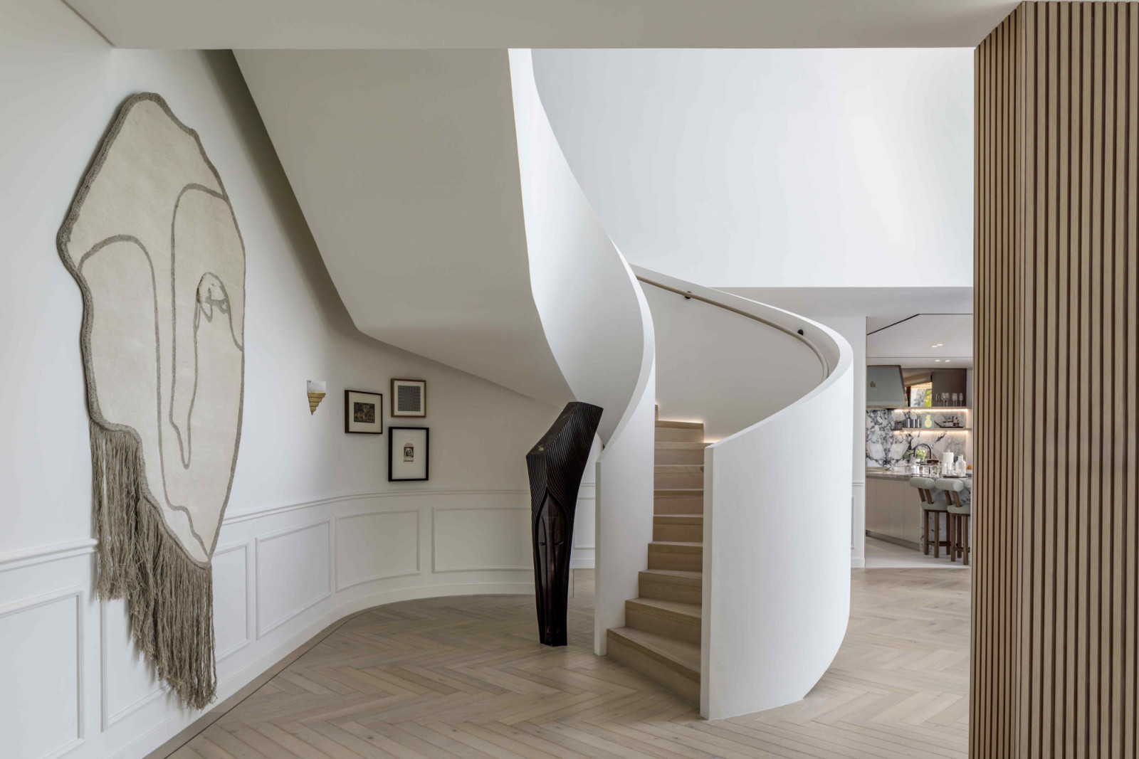 The sculptural staircase was inspired by one the homeowner admired at The Edition Hotel in New York