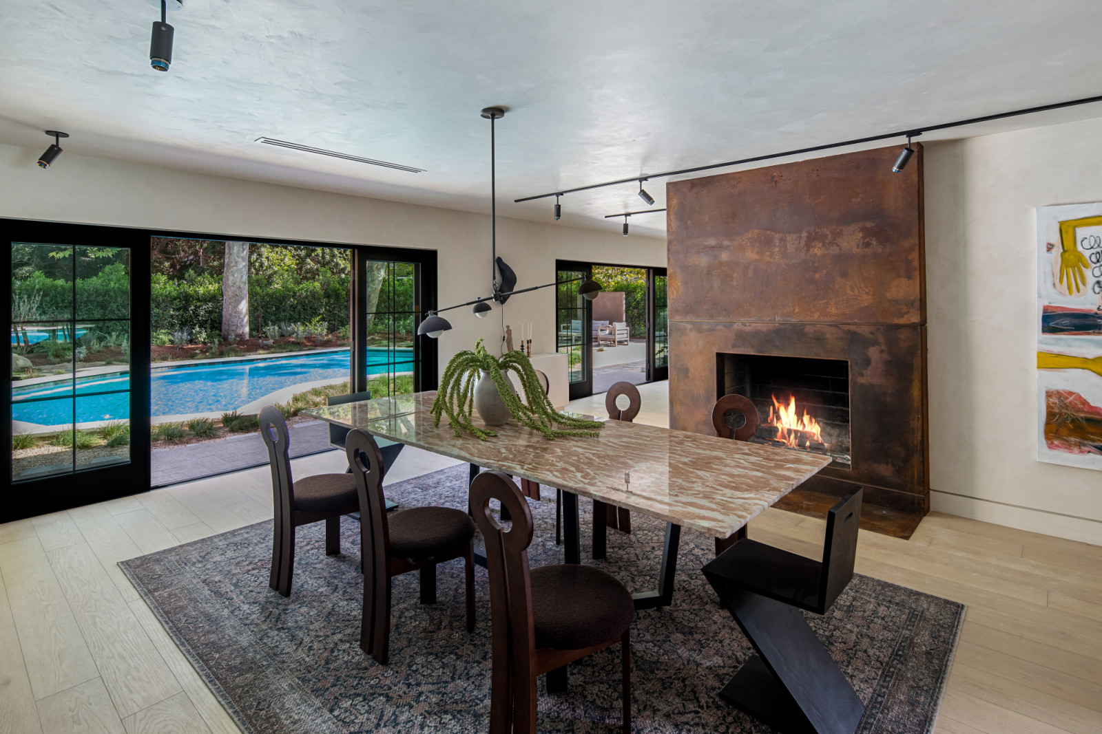 The dining room of a renovated modern ranchette in Beverly Hills, Los Angeles designed by Samaha Studio