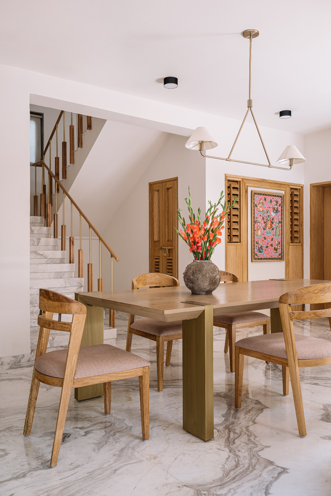The dining room of a multigenerational family home in Ahmedabad, India, designed by Compartment S4