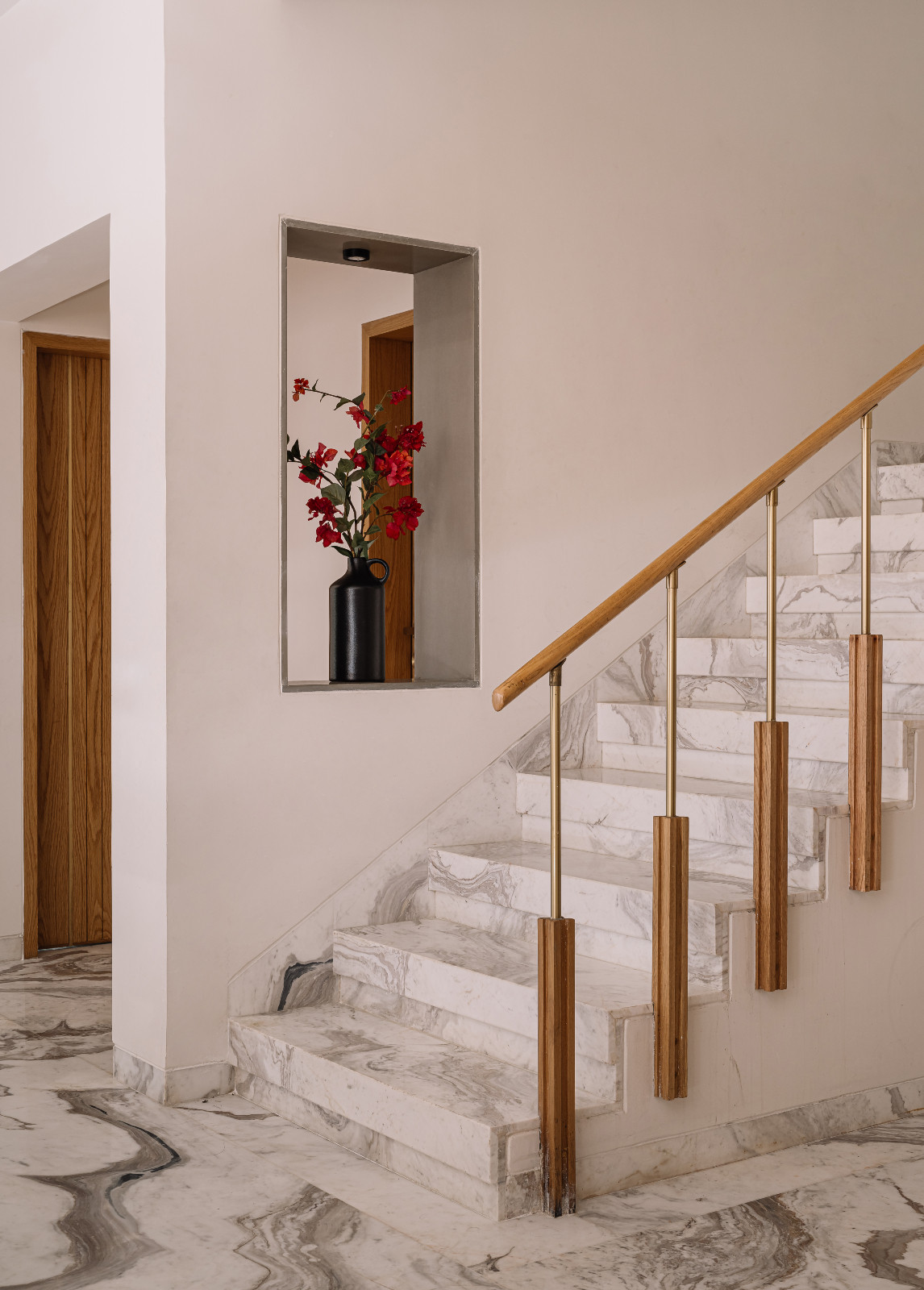 The stairway of a multigenerational family home in Ahmedabad, India, designed by Compartment S4