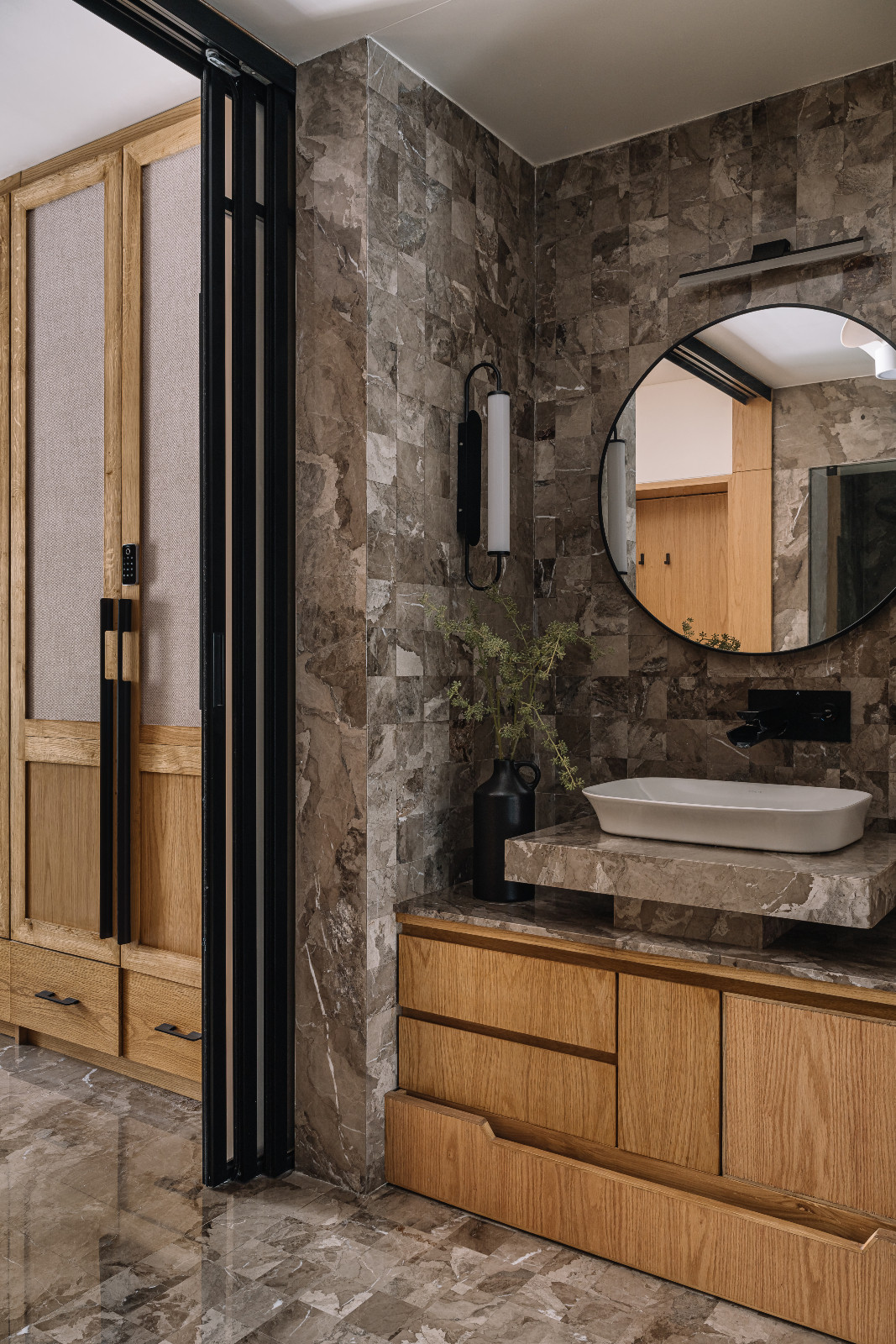 The powder room of a multigenerational family home in Ahmedabad, India, designed by Compartment S4