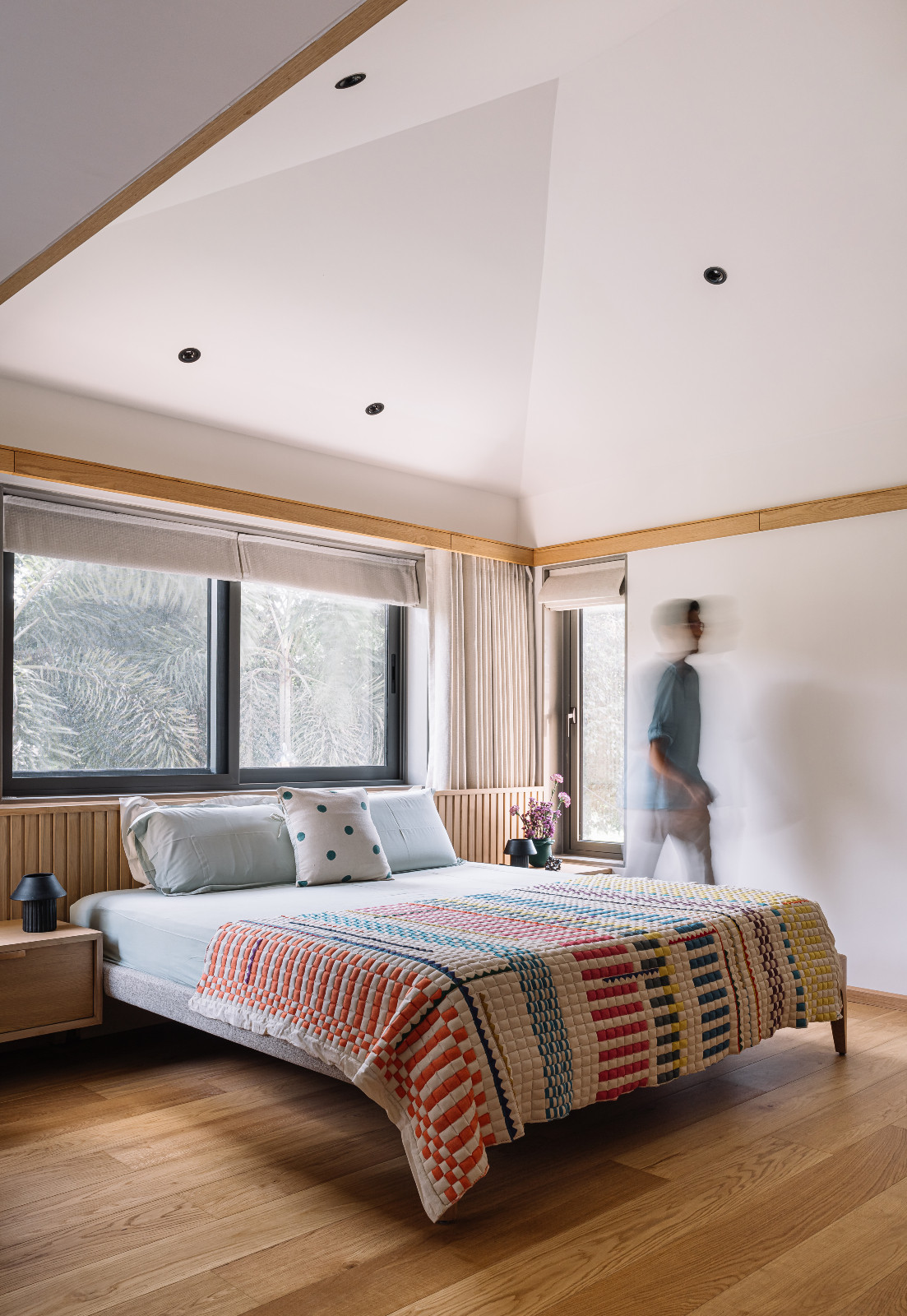 A bedroom in a multigenerational family home in Ahmedabad, India, designed by Compartment S4