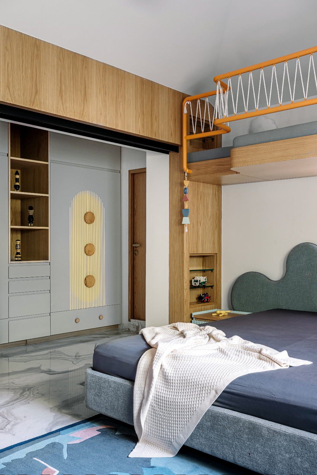 A bedroom in a multigenerational family home in Ahmedabad, India, designed by Compartment S4