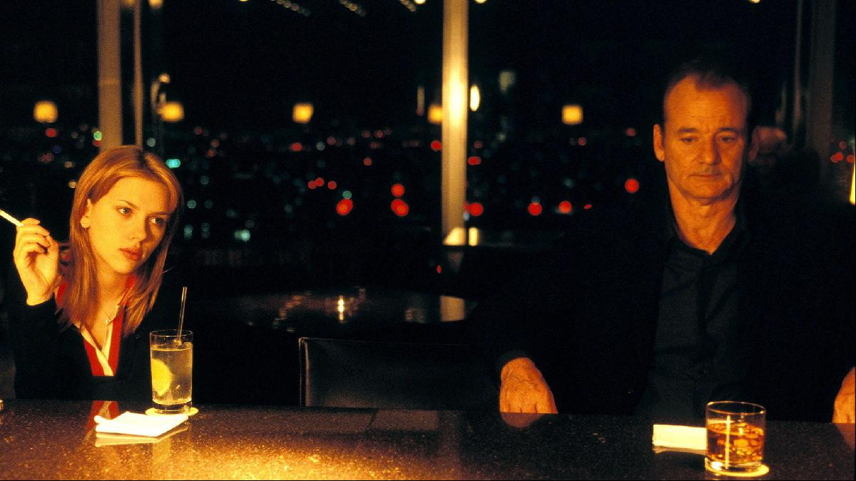 Scarlett Johansson and Bill Murray in a scene from Lost in Translation, filmed at the New York Bar on the 52nd floor of Park Hyatt Tokyo. The property remains one of cinema's most celebrated film hotels.
