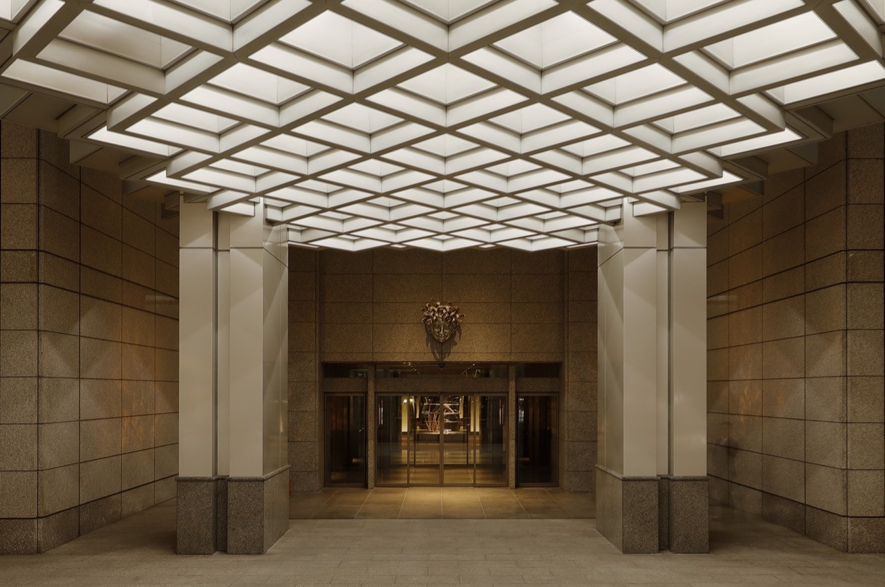 The main entrance features a geometric coffered ceiling and Hokkaido water elm panelling preserved during Jouin Manku’s renovation