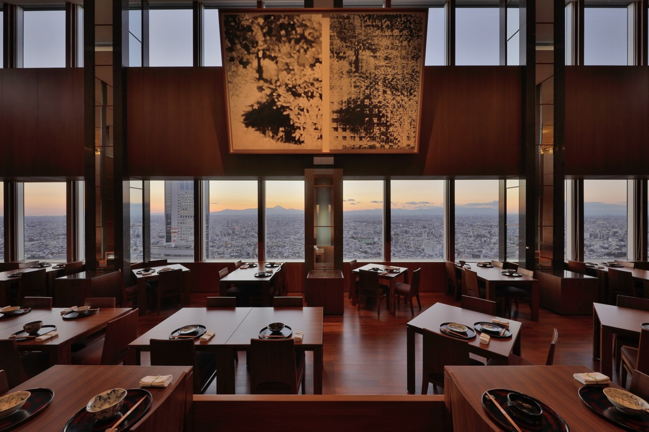 Kozue restaurant features traditional Japanese low seating and contemporary artwork, with Mount Fuji visible on a clear day