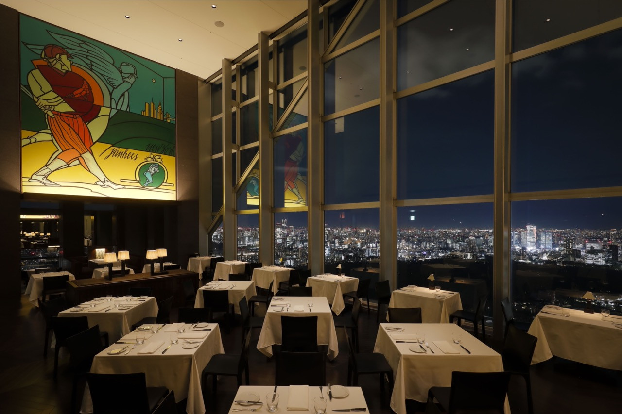 The hotel’s signature restaurant preserves its original vintage sports artwork whilst offering panoramic city views
