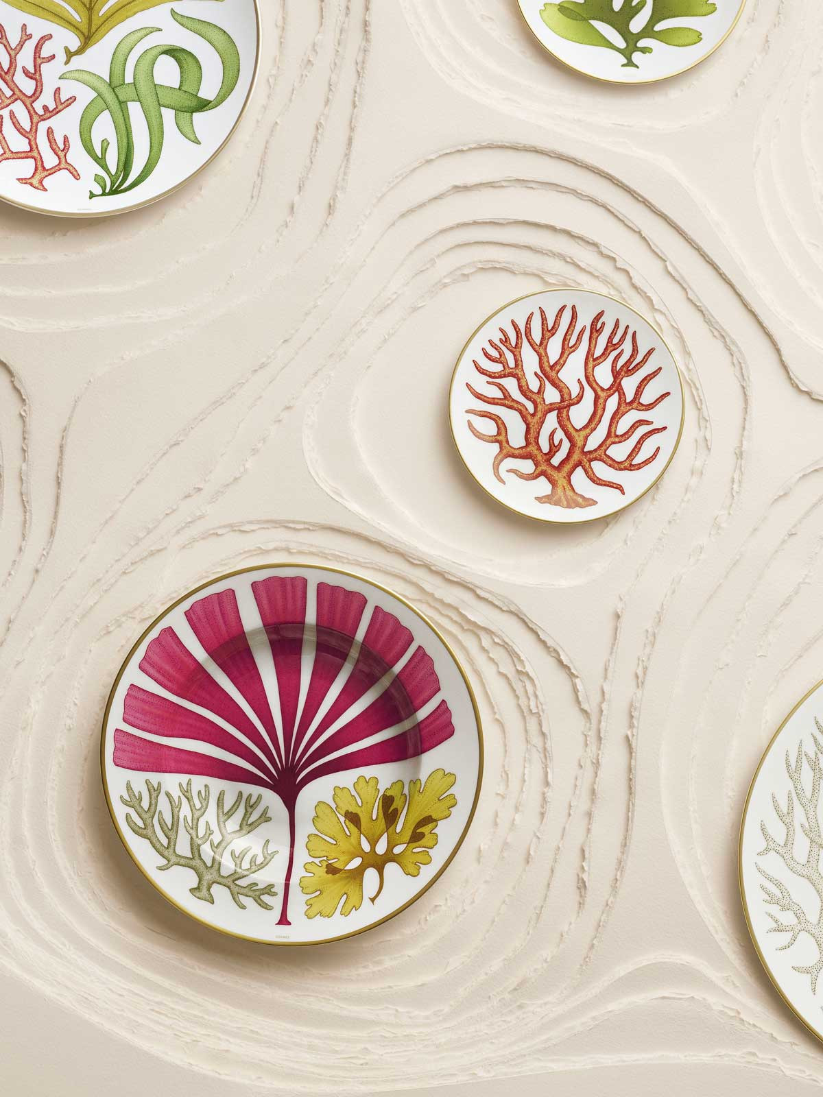 Beyond dinner plates and bowls, the collection also includes teapots, mugs, trays and even a porcelain vase