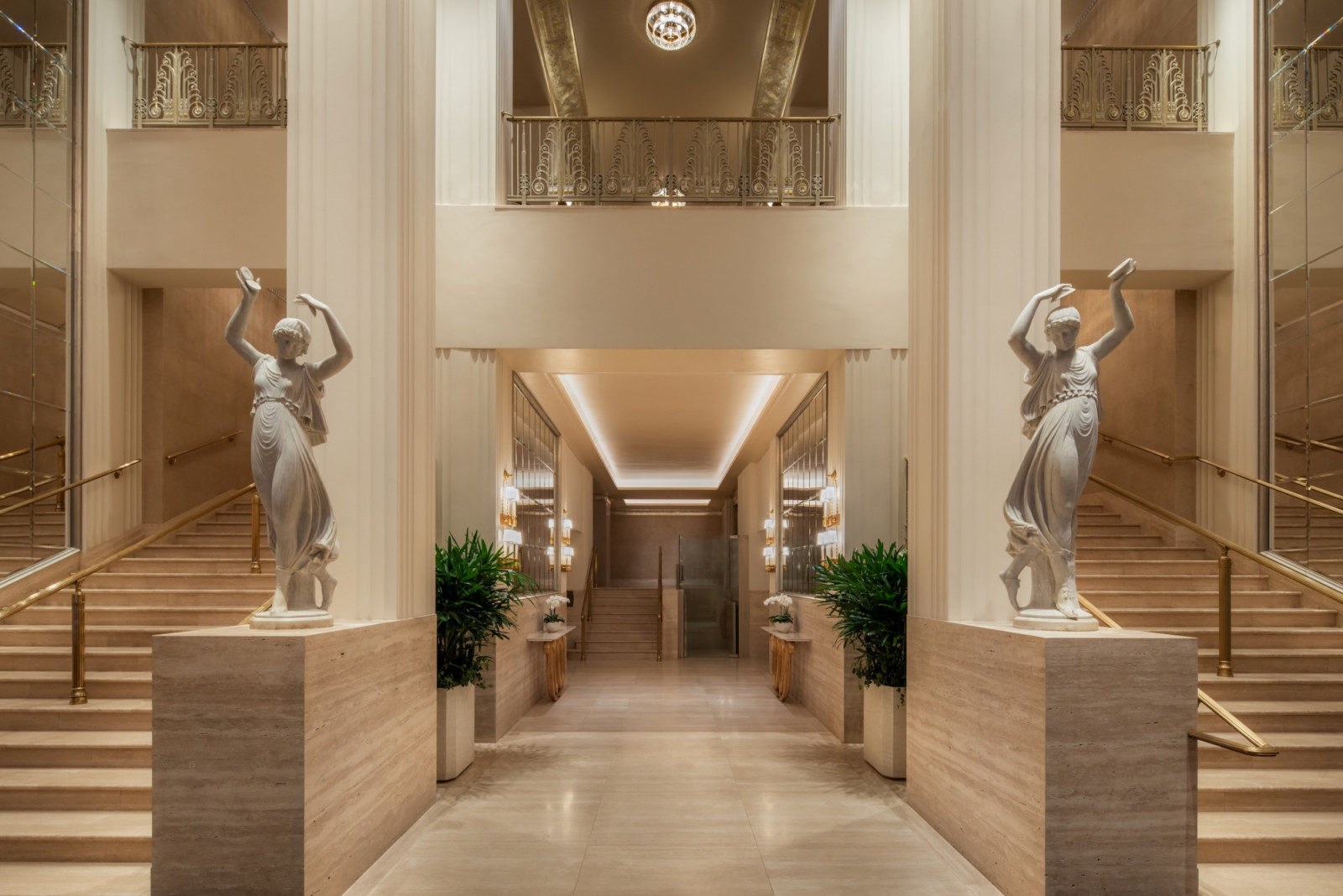 The restored Grand Staircase features classical sculptures and travertine stone, leading to public spaces where Scent of a Woman was filmed, including Al Pacino’s famous tango scene at this iconic film hotel