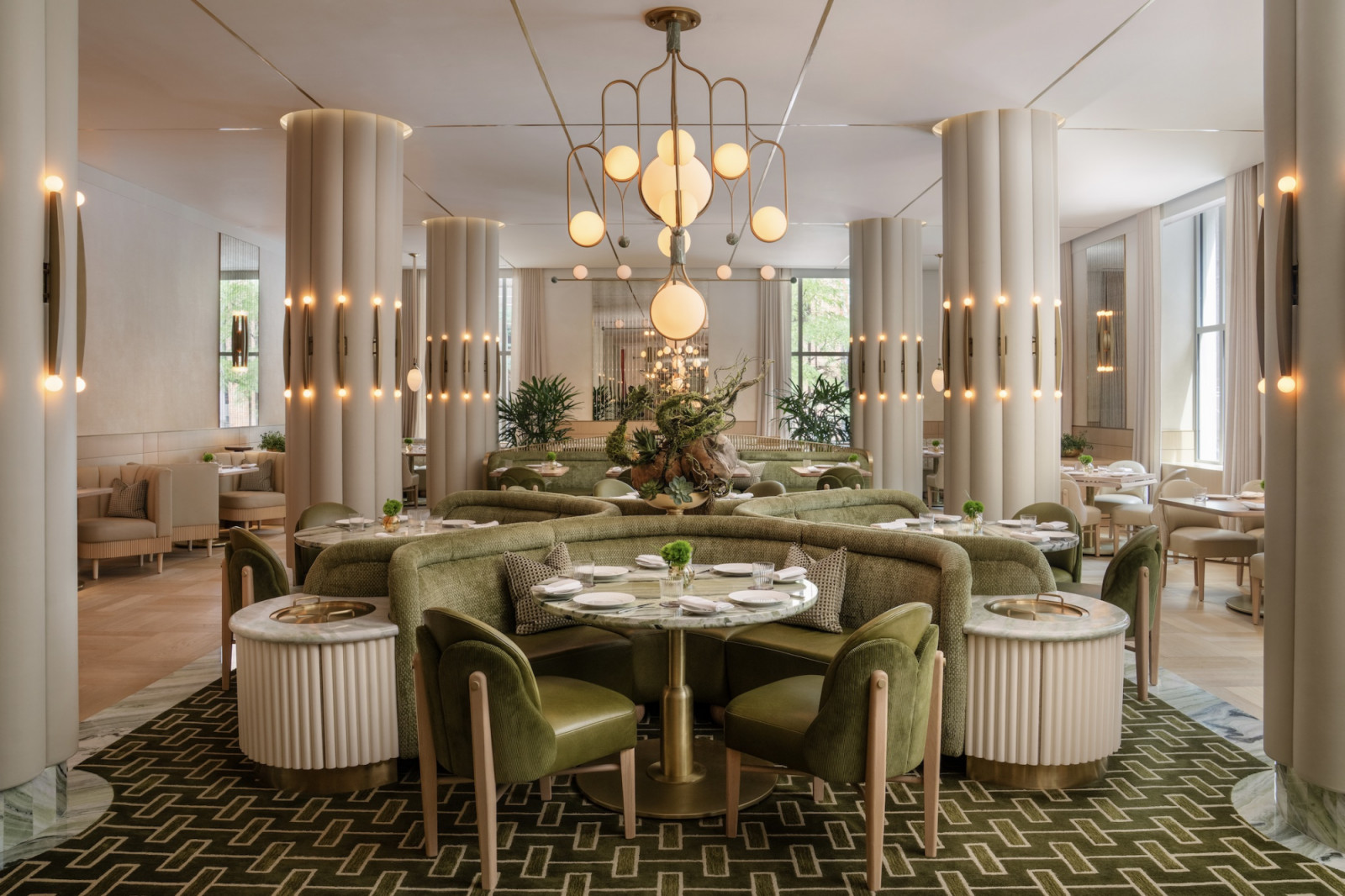 Pierre-Yves Rochon designed contemporary interiors with custom lighting and velvet seating throughout the renovated film hotel