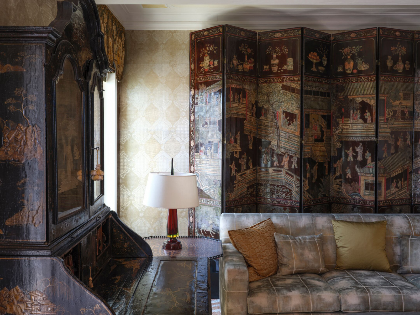 An 18th-century Chinese coromandel screen anchors a suite library, representing Peter Marino's layered approach to Old Venice merchant aesthetics at this historic film hotel