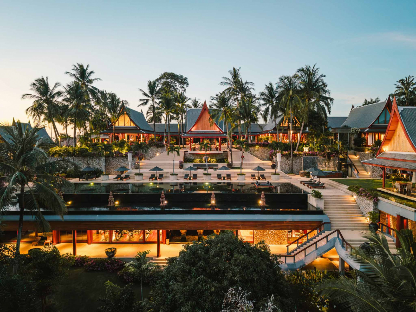 An aerial perspective of the Chandara estate reveals its village-like layout, with villas dispersed across the site, peeking out on the far left is the roof of a villa containing Zeman’s bedroom and study, which remain closed to guests