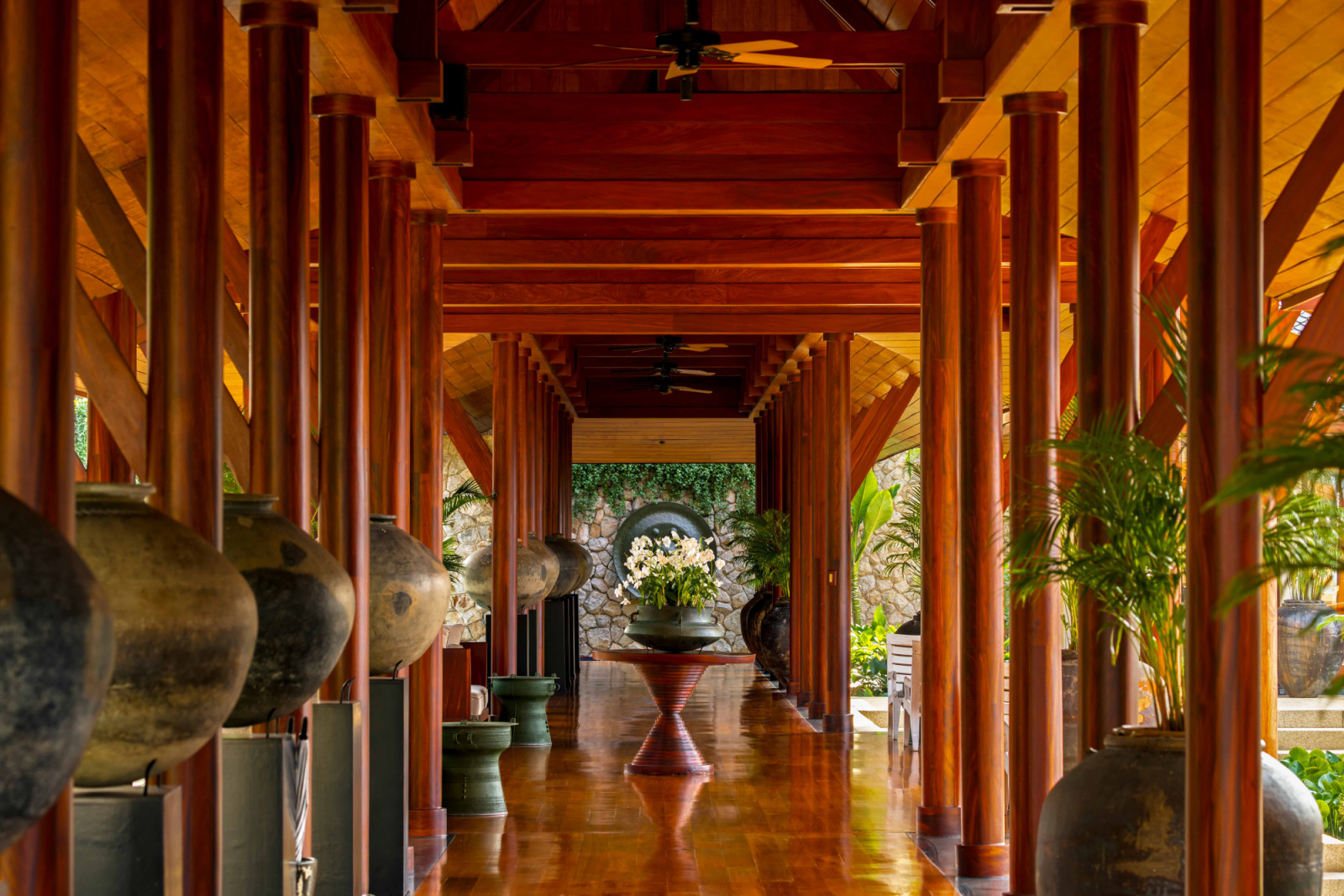 Chandara’s entrance pavilion is constructed in wood with a reddish hue characteristic of Southeast Asia