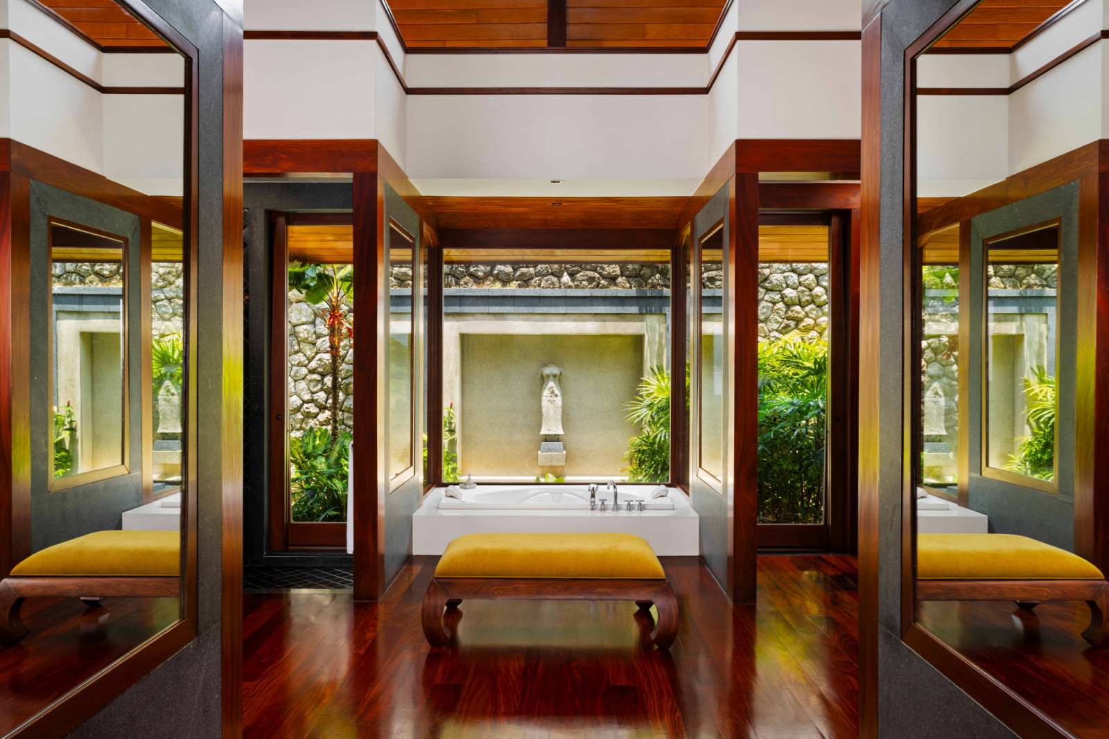 The en suite bathroom is defined by pleasing symmetry, with mirrored surfaces amplifying the sense of space; an adjacent wardrobe completes the layout, a configuration later replicated at Andara, Zeman’s resort across the bay