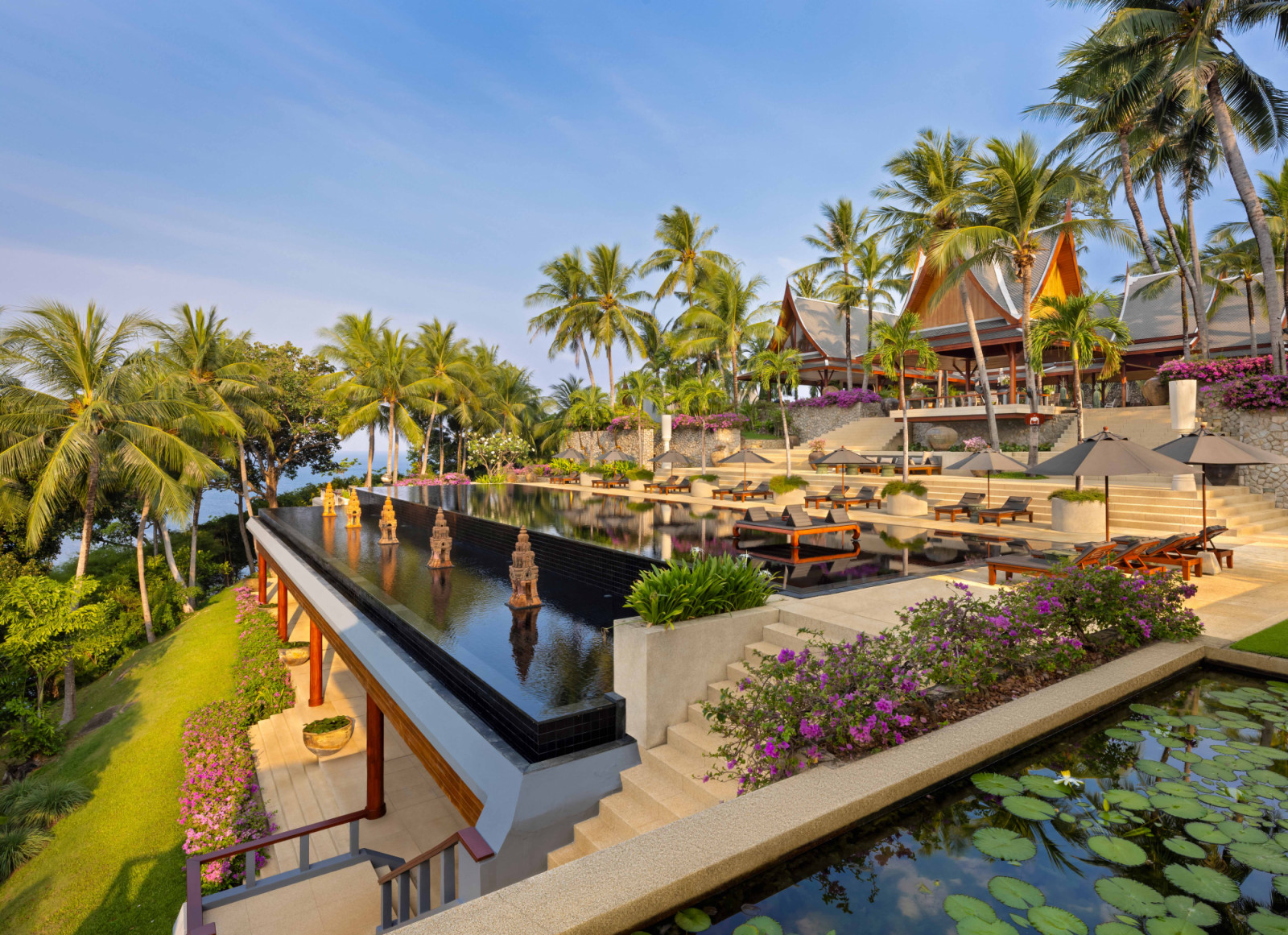 The main pool terrace reflects a shared architectural lineage with Phuket’s early resort icons, shaped through close collaboration between Zeman and his architect friend