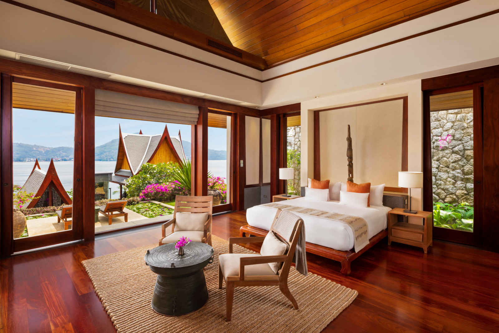 The Ocean View Pavilion features sun loungers outside by the lily pond