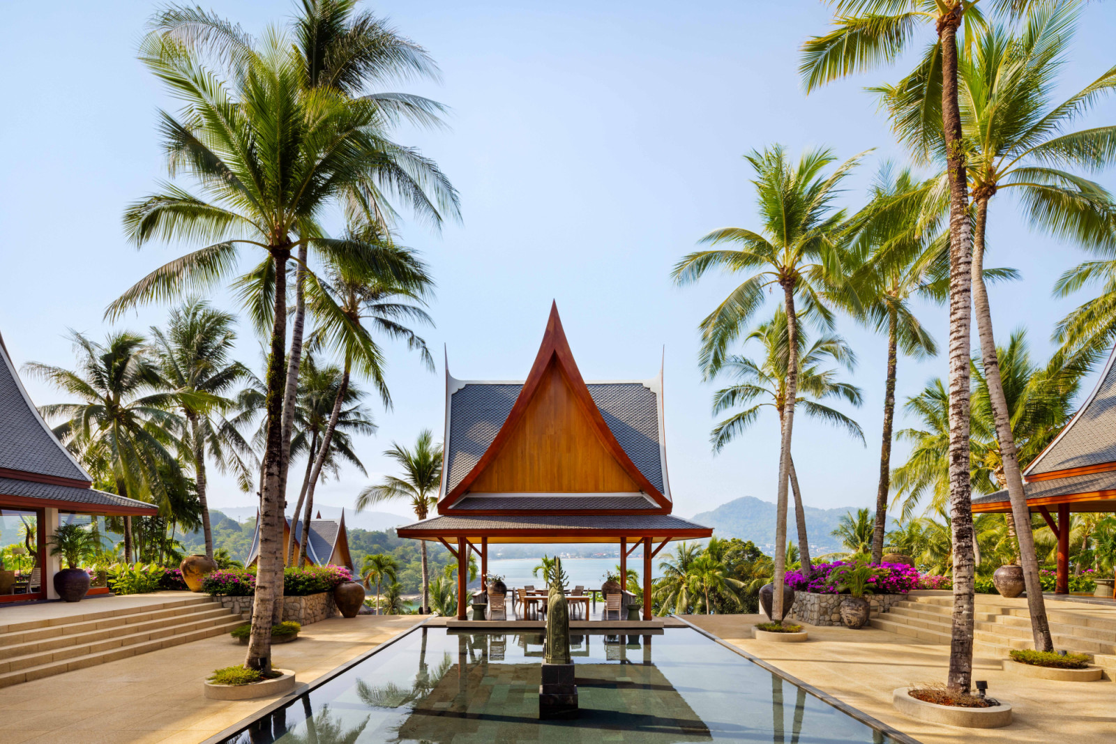 The outdoor dining sala—traditional Thai open pavilion, typically roofed and columned, designed for shaded gathering, dining or rest while remaining open to breezes and views