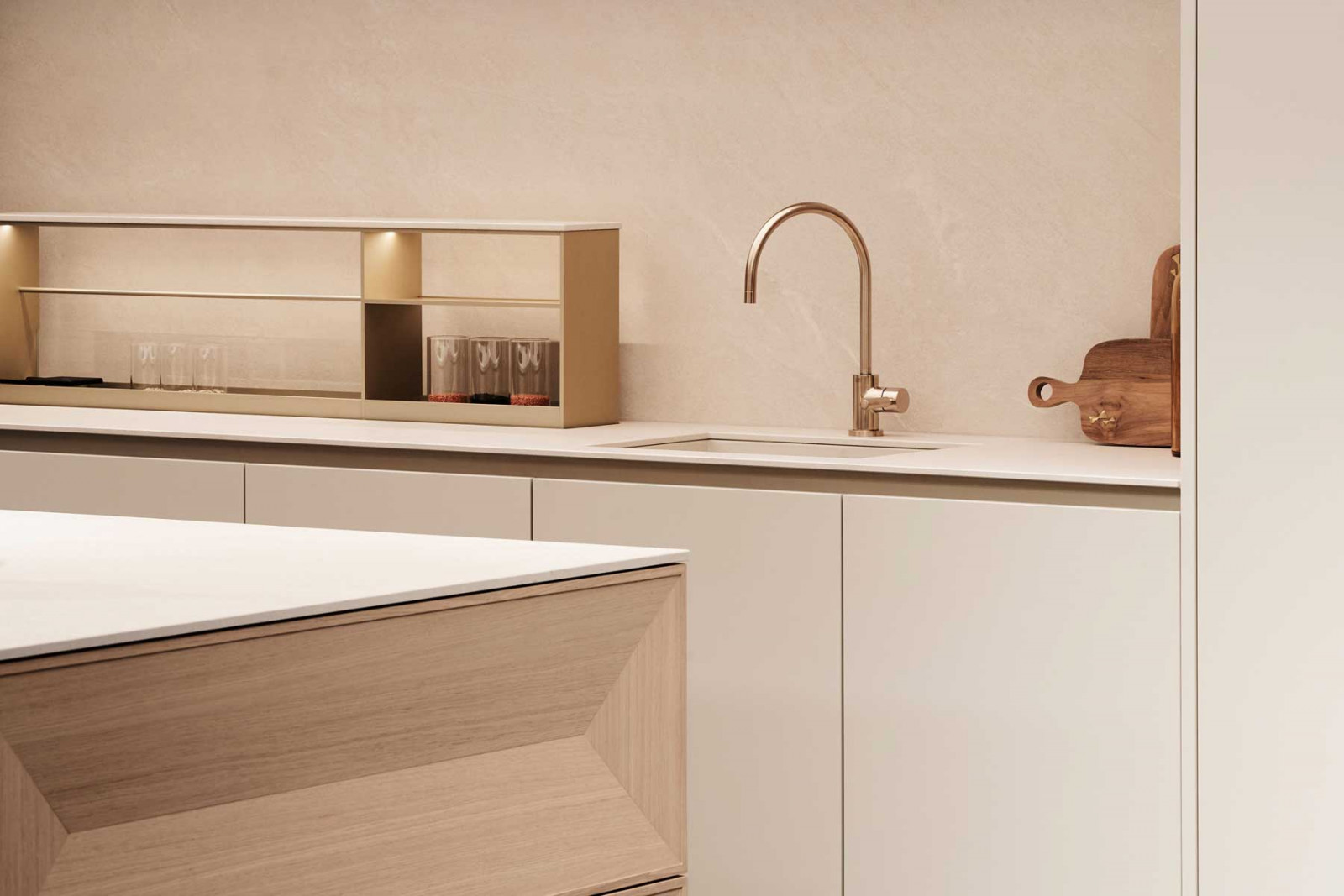 Metallic champagne fixtures in the Taglio kitchen complement light oak and sandy ceramic surfaces