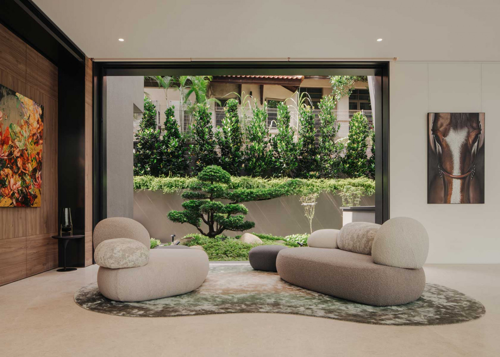 The spacious living area that opens up to lush greenery