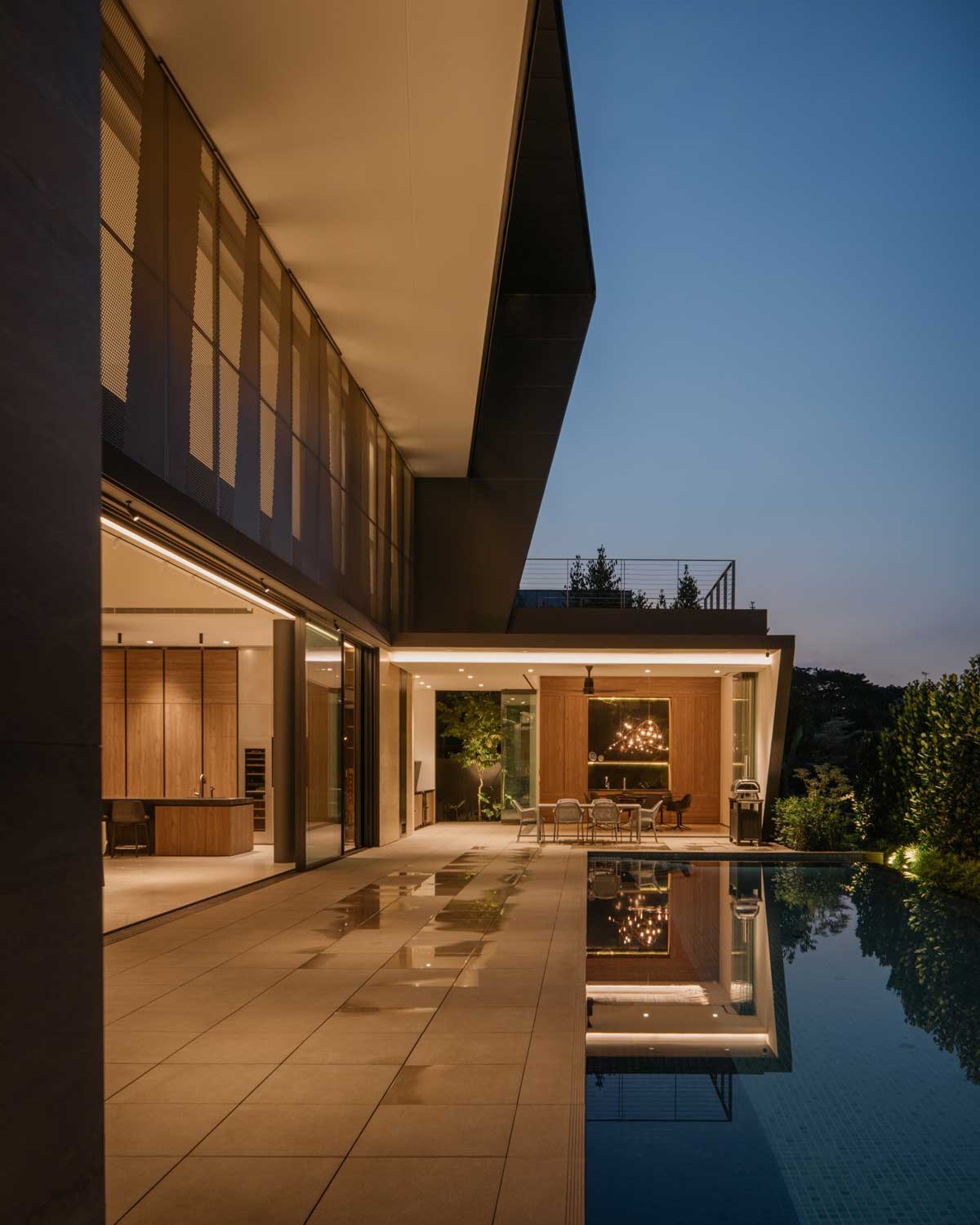 The outdoor pavilion of The Fold awash in golden light as night falls