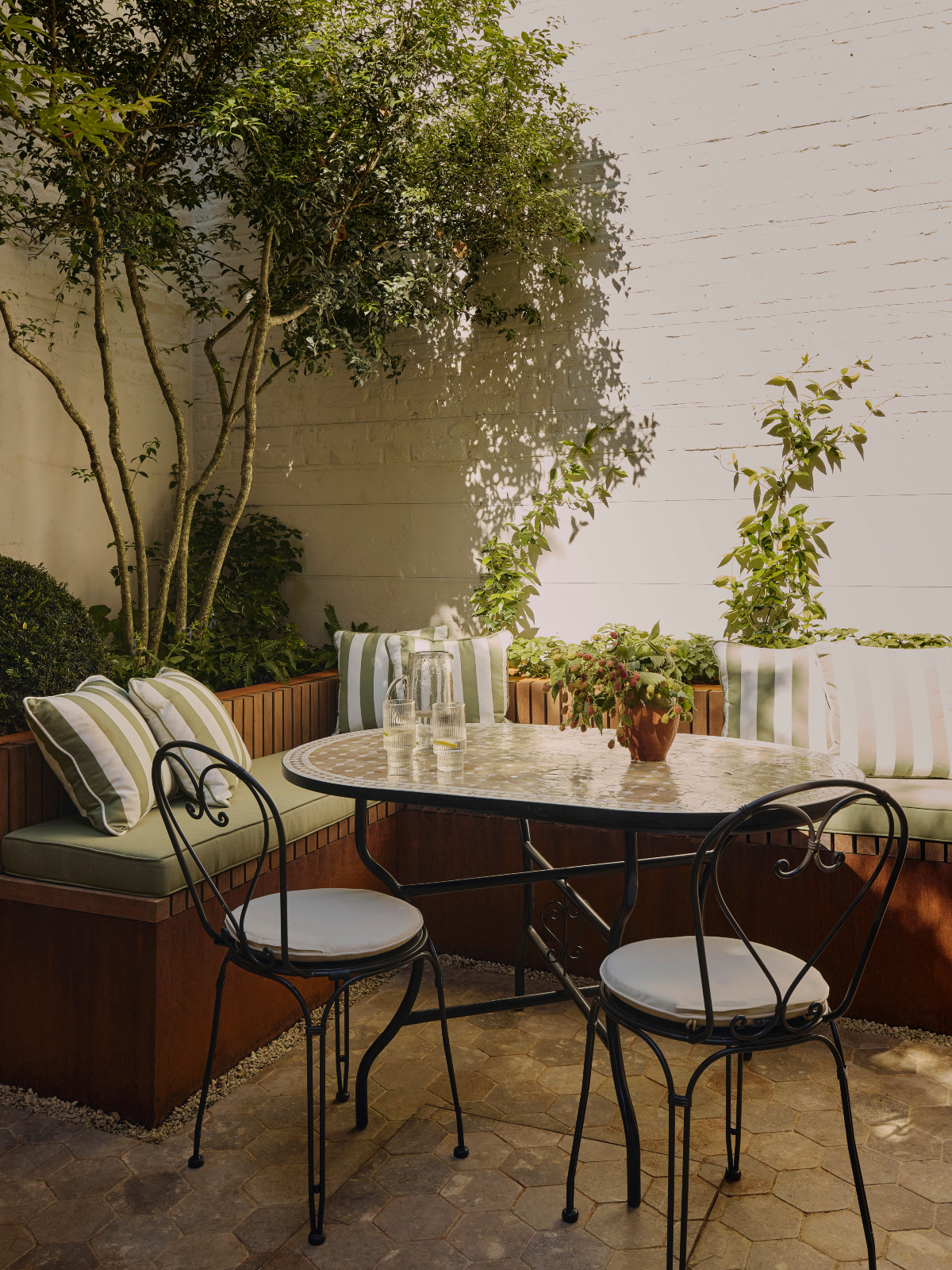 The terrace dining area of a Georgian townhouse renovated by Jack Simpson in London, England