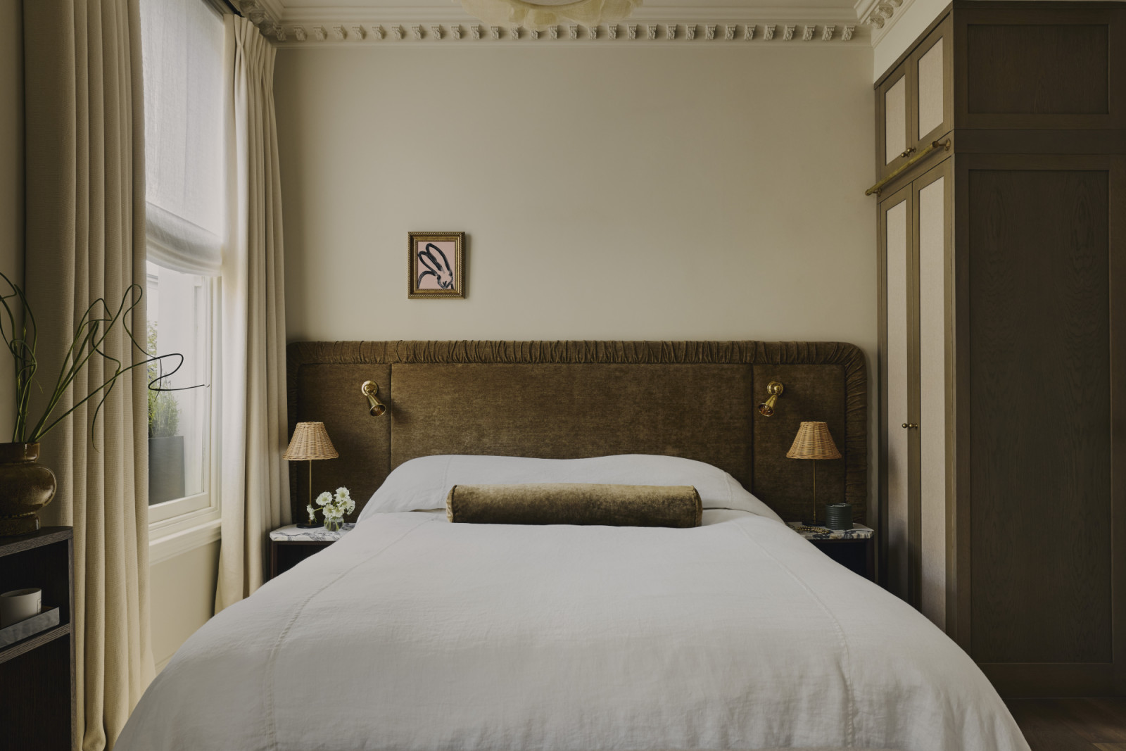 The bedroom of a Georgian townhouse renovated by Jack Simpson in London, England