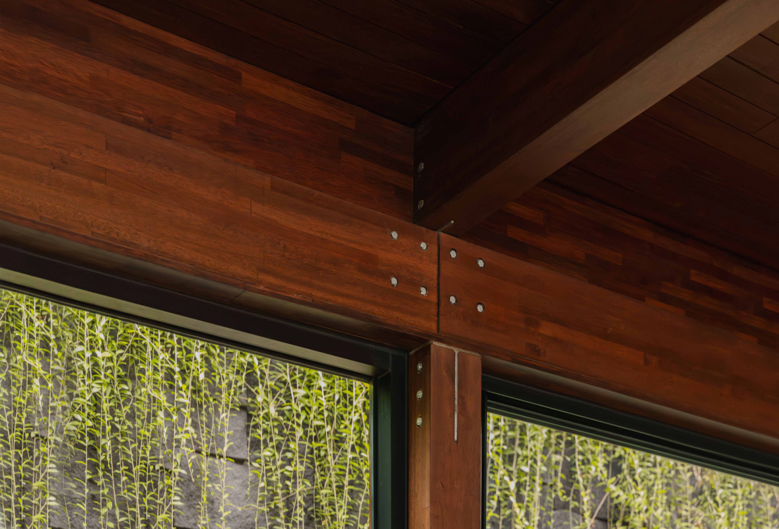 A close-up of Woodlam’s glulam joinery highlights the craftsmanship of the engineered timber structure