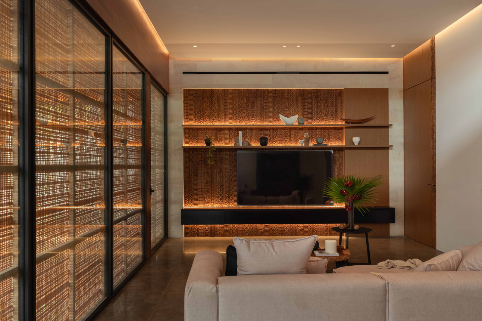 The upper-floor living room is arranged to function as an independent apartment