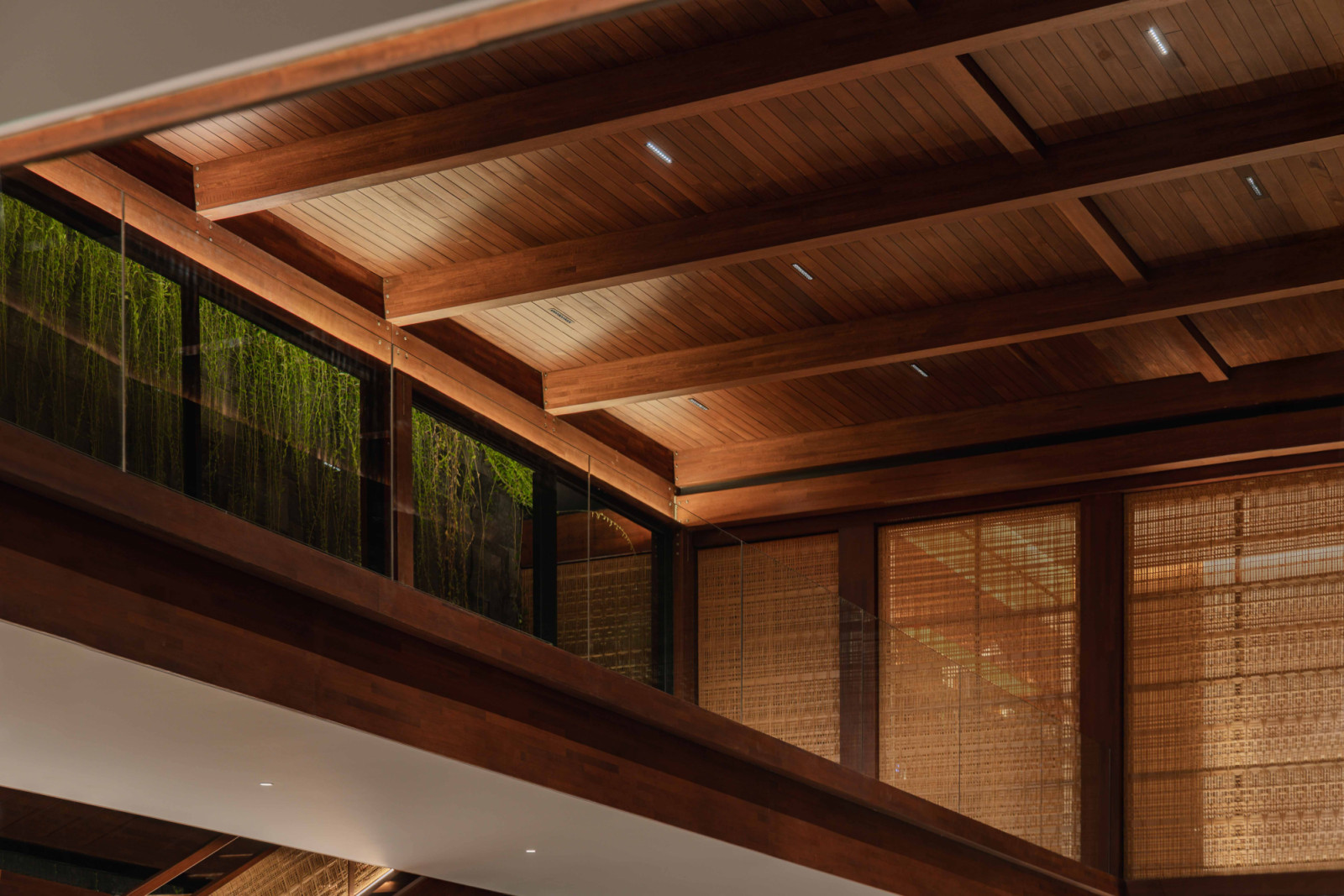 Carefully lit, the exposed timber detailing in the ceiling becomes a defining design feature