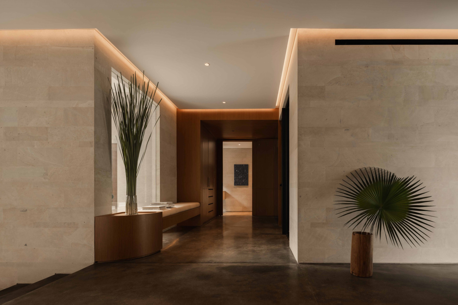 Clean-cut steel, stone and timber define the circulation space, emphasised by its generous proportions as well as controlled lighting