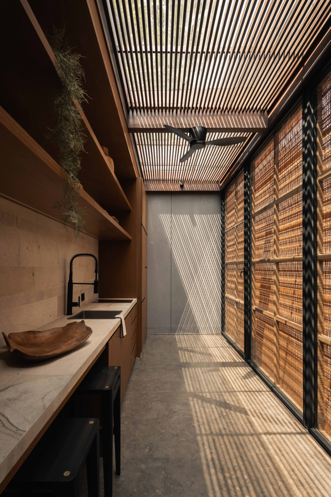 Synthetic rattan panels were selected for their durability and the way they articulate light as it filters through