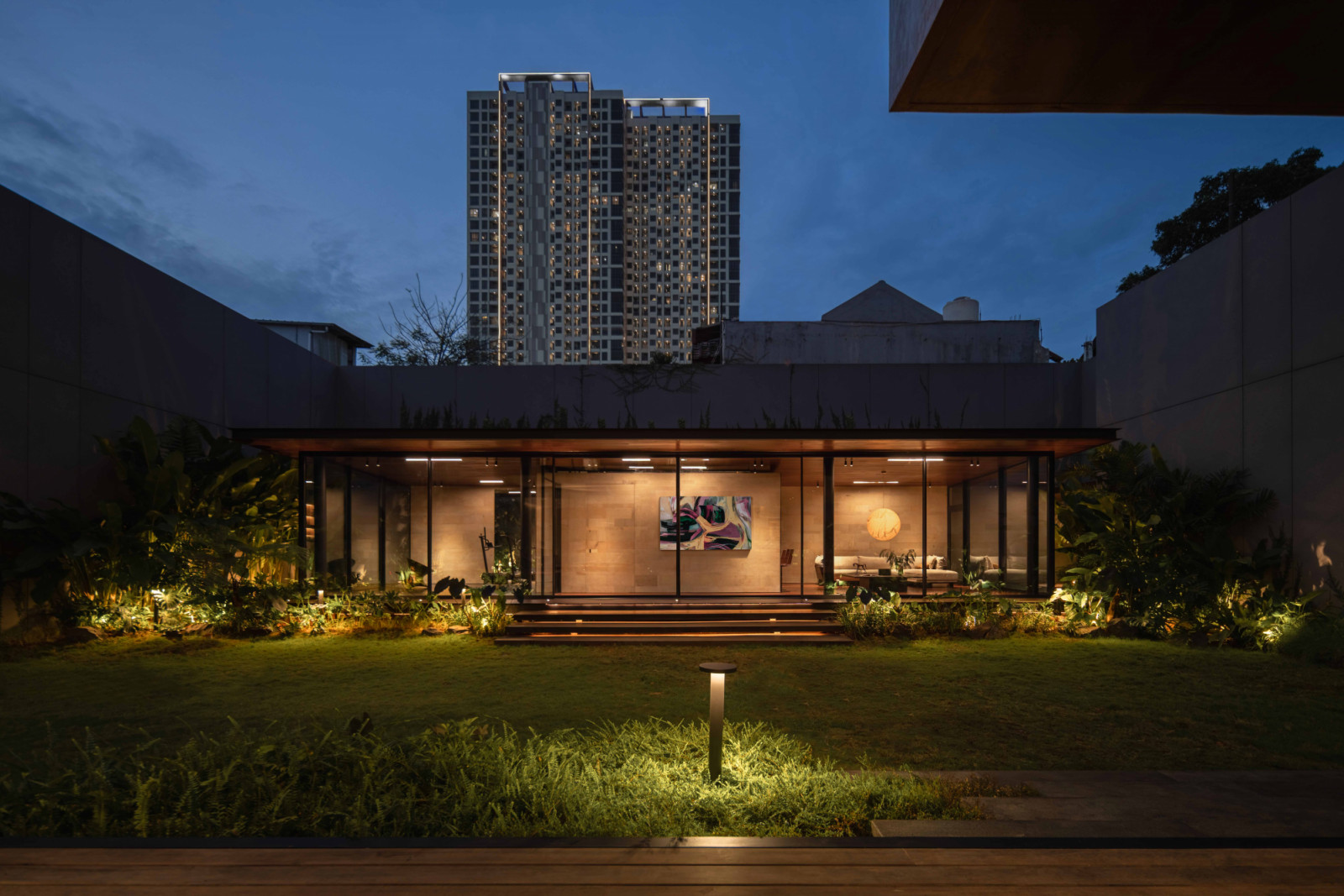 The gallery slash gym at the rear of the site is designed as a lightweight structure that can be easily dismantled as the families expand
