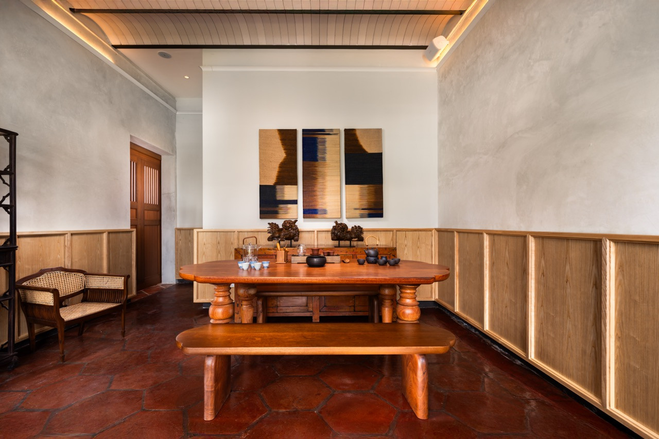 The Tranquillity Room with salvaged hexagonal terracotta tiles and timber panelling, where custom furniture by local makers sits alongside contemporary artwork