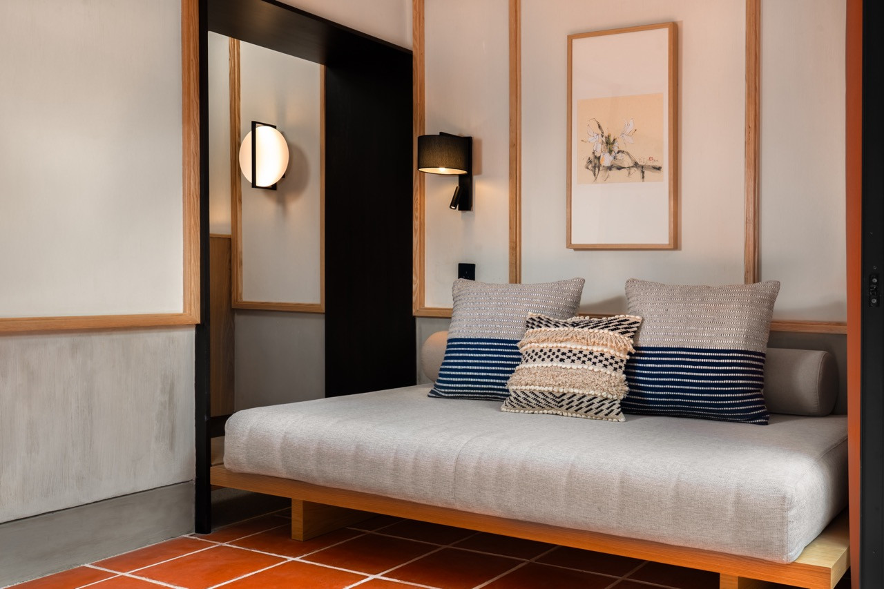 Garden Suite lounge with salvaged terracotta floor tiles left intact, cracks included