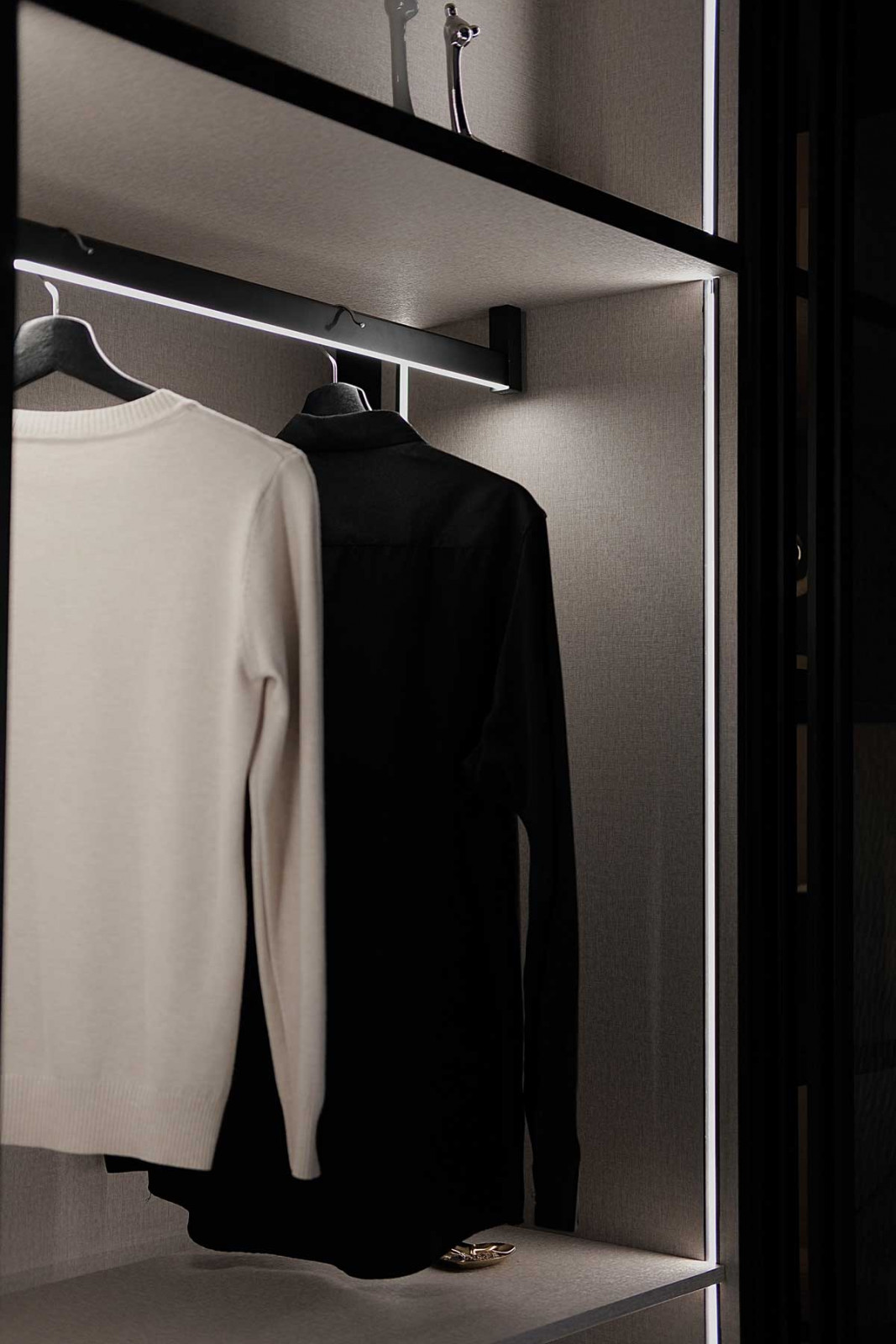 The Square Hanging Rod Light With Motion Sensor illuminates wardrobes effortlessly