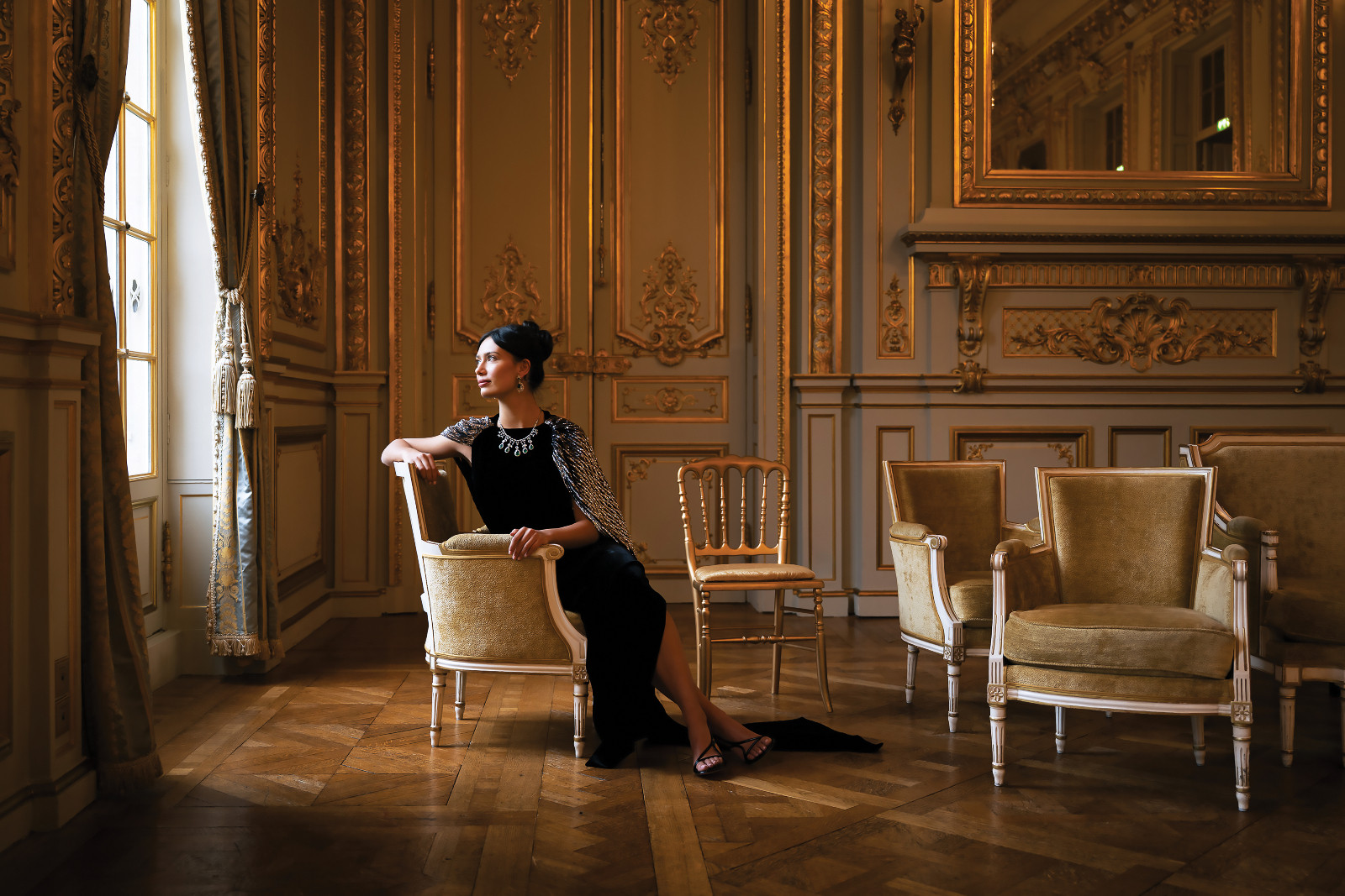 Alexandra Cruz-Moxey wore a black, Art Deco–inspired dress with silver-and-black caped fringe by Lanvin at the 2025 le Bal des Débutantes, held at Shangri-La Paris