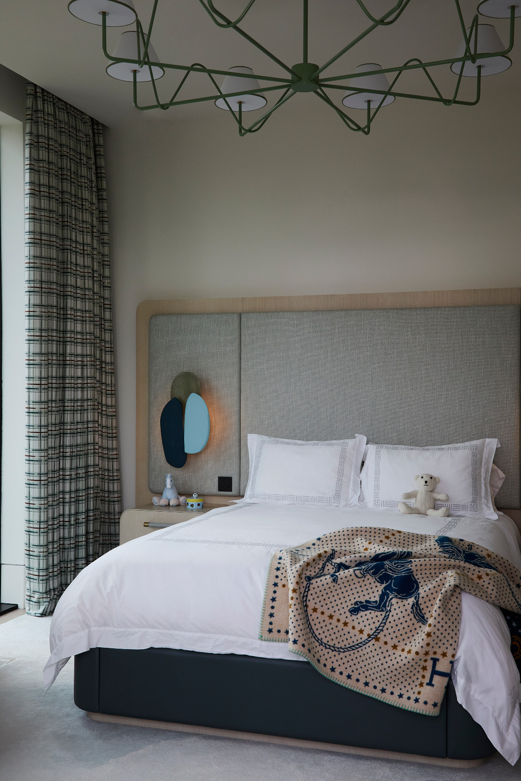 The bedroom in a waterfront Miami Beach home designed by Strang Architects with Pembrooke + Ives