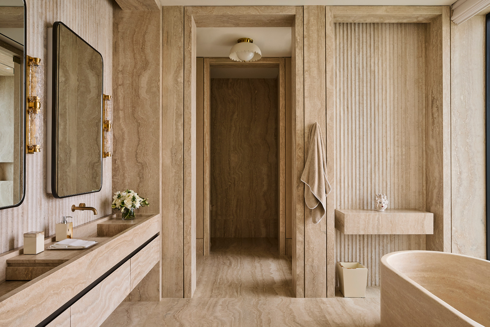 The ensuite bathroom in a waterfront Miami Beach home designed by Strang Architects with Pembrooke + Ives