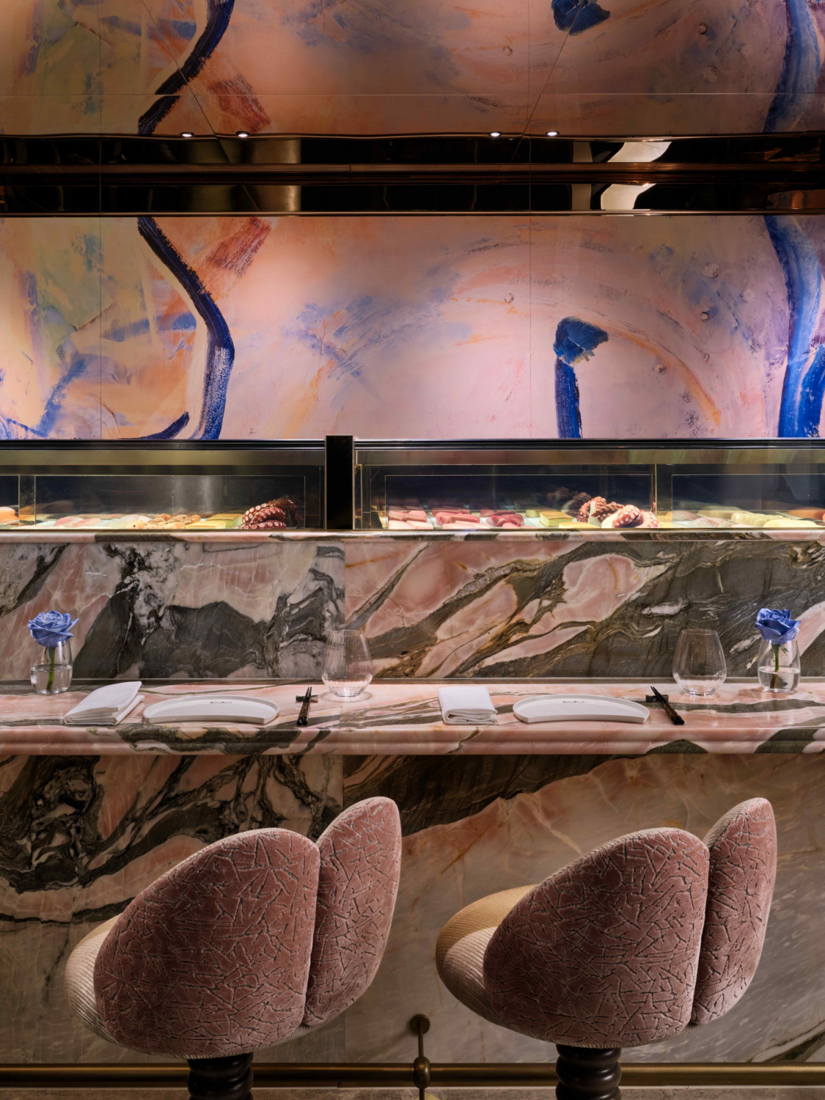 Artwork by Young Hee Back provides a vibrant backdrop to the intimate sushi bar (Photo: Owen Raggett)