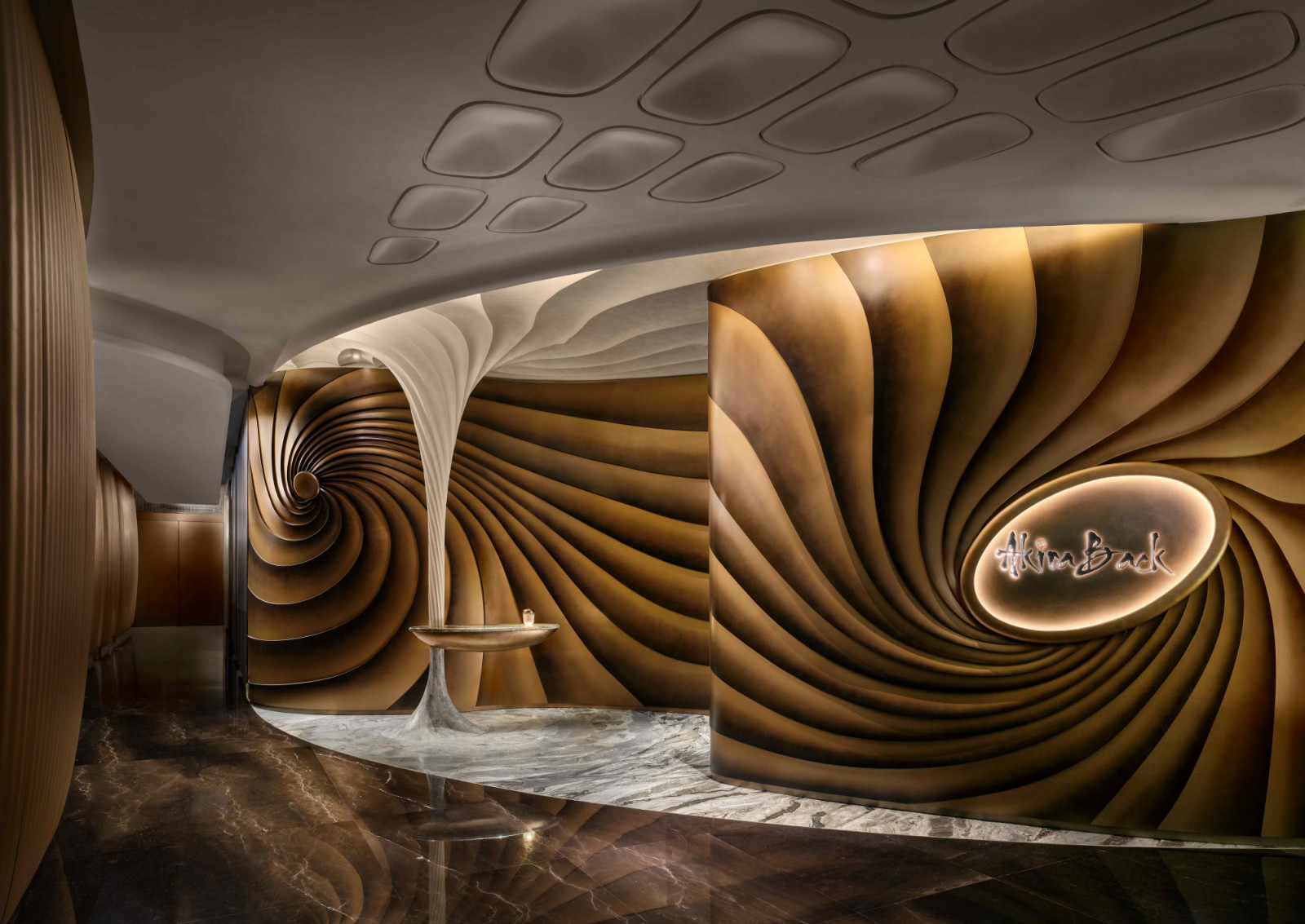 The grand entrance of Akira Back Hong Kong, featuring handcrafted metal-structured walls (Photo: Owen Raggett)