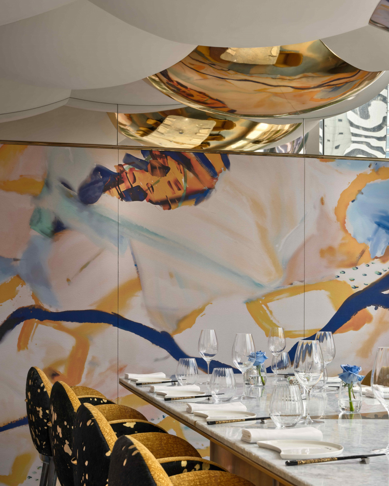 The graffiti-inspired walls create a layered and visually striking setting (Photo: Owen Raggett)
