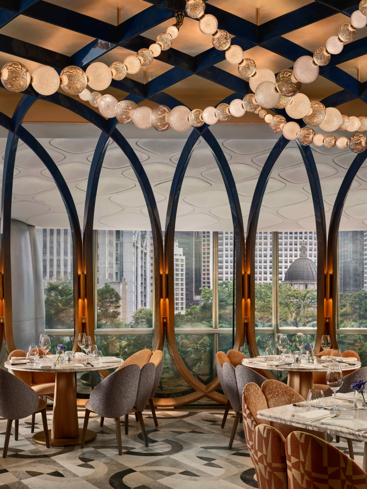 Sculptural enclosures coated in gold leaf reflects the organic curves of The Henderson’s façade (Photo: Owen Raggett)