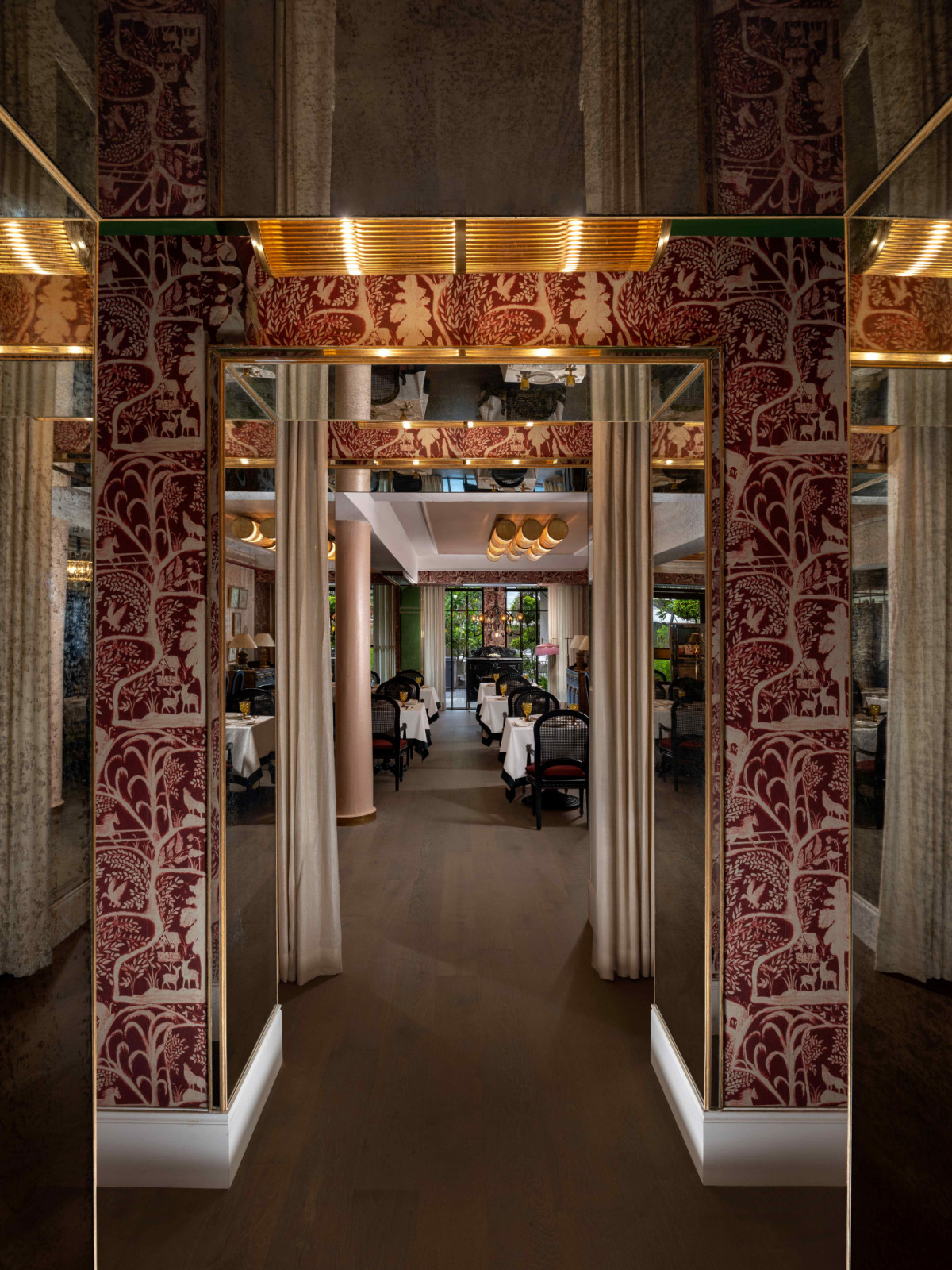 A subtle homage to Versailles’ Hall of Mirrors along the entryway (Photo: Beyond Designs)