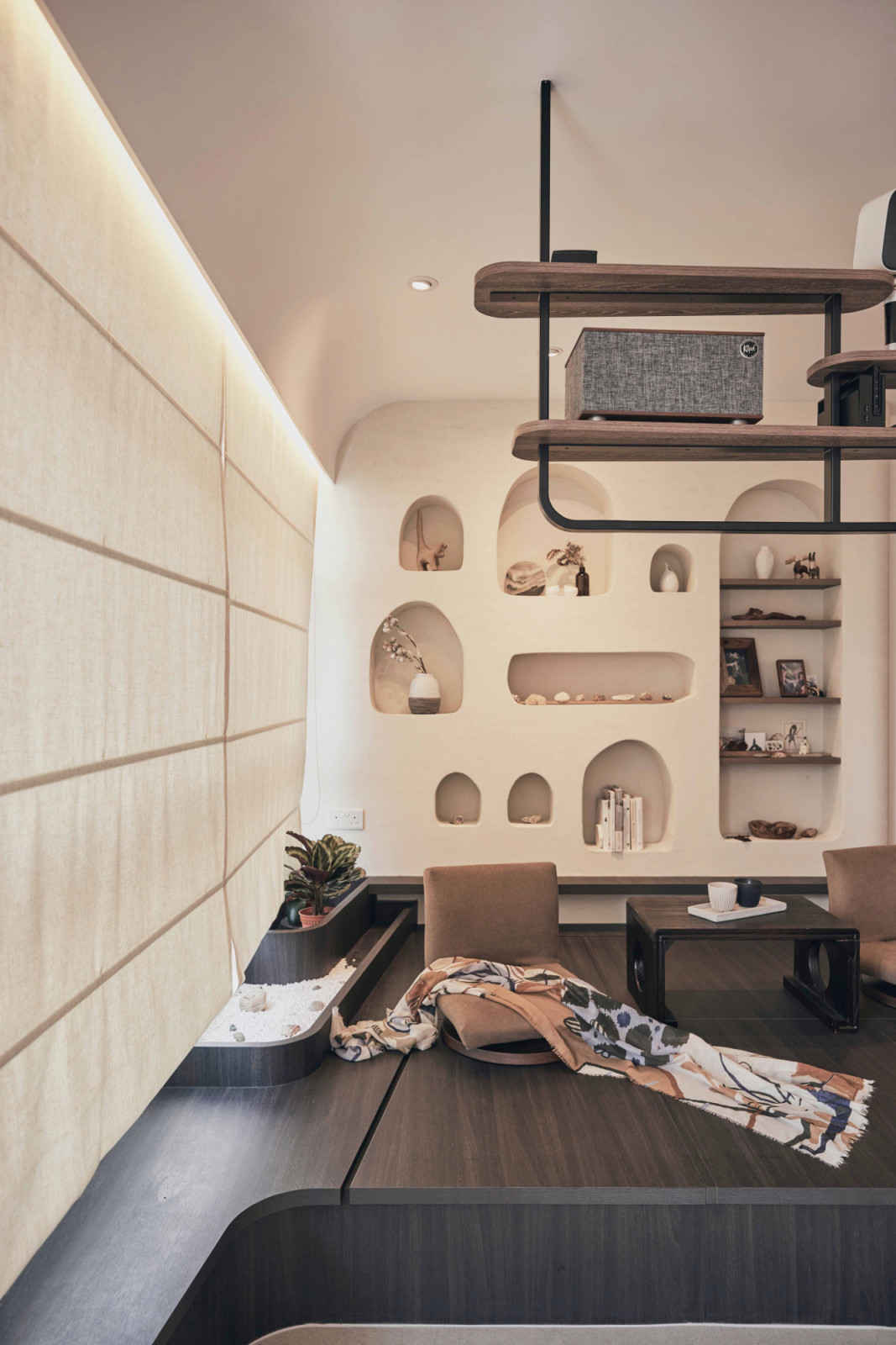 Charming display niches house the owners’ travel collectibles in this Bedok South home by AMP Design Co