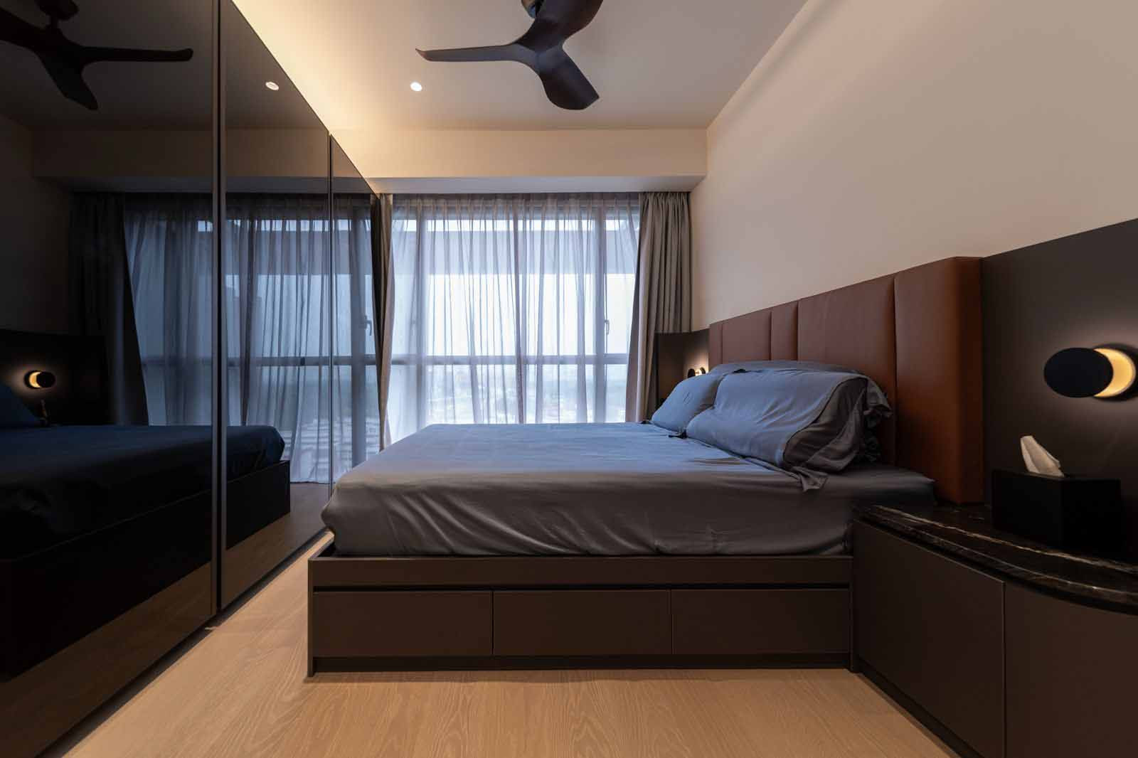 A hushed, dark-toned master bedroom at Jadescape enhanced by a discreet smart home system by Home-A-Genius
