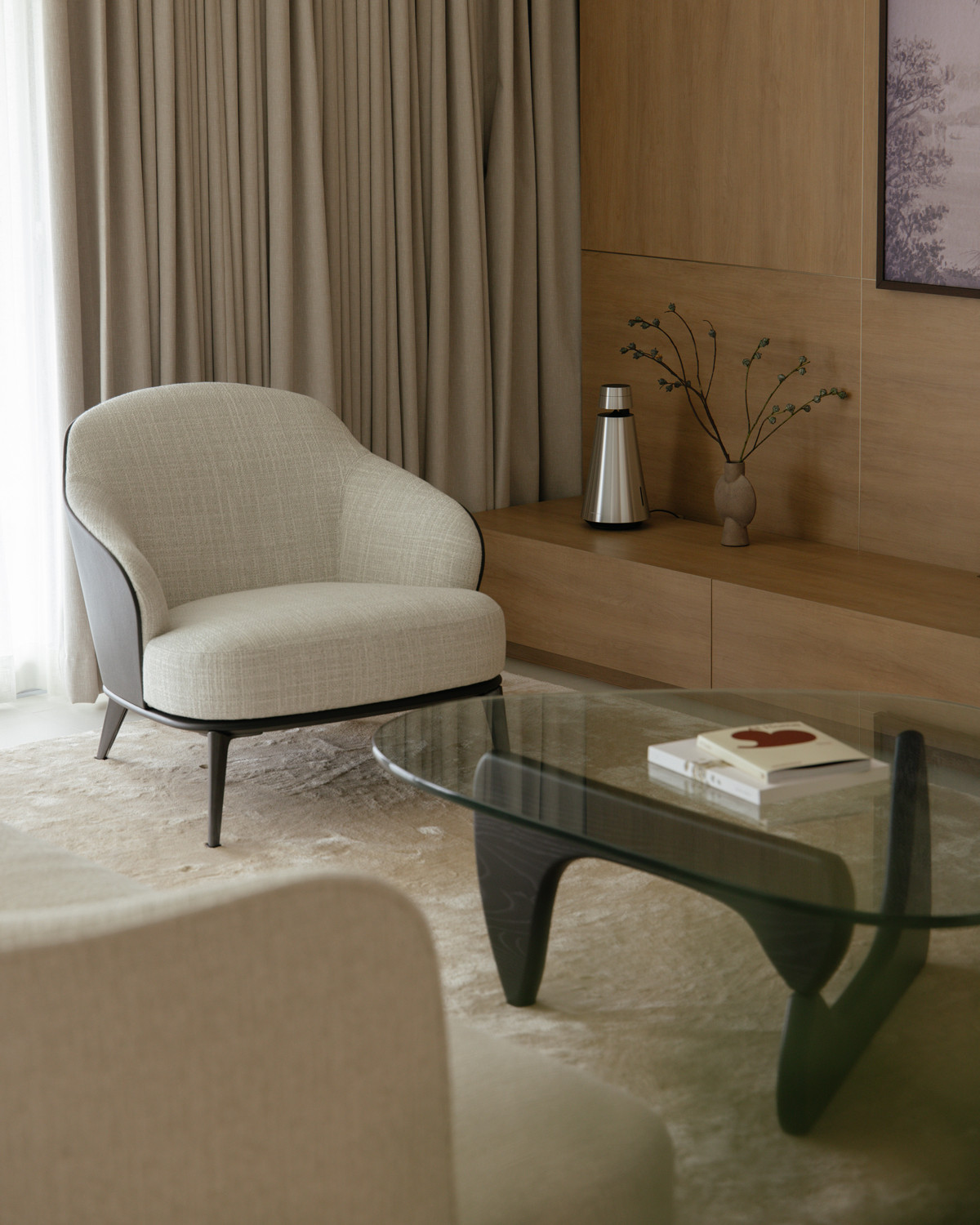 Designer pieces introduce a touch of quiet luxury to the living space