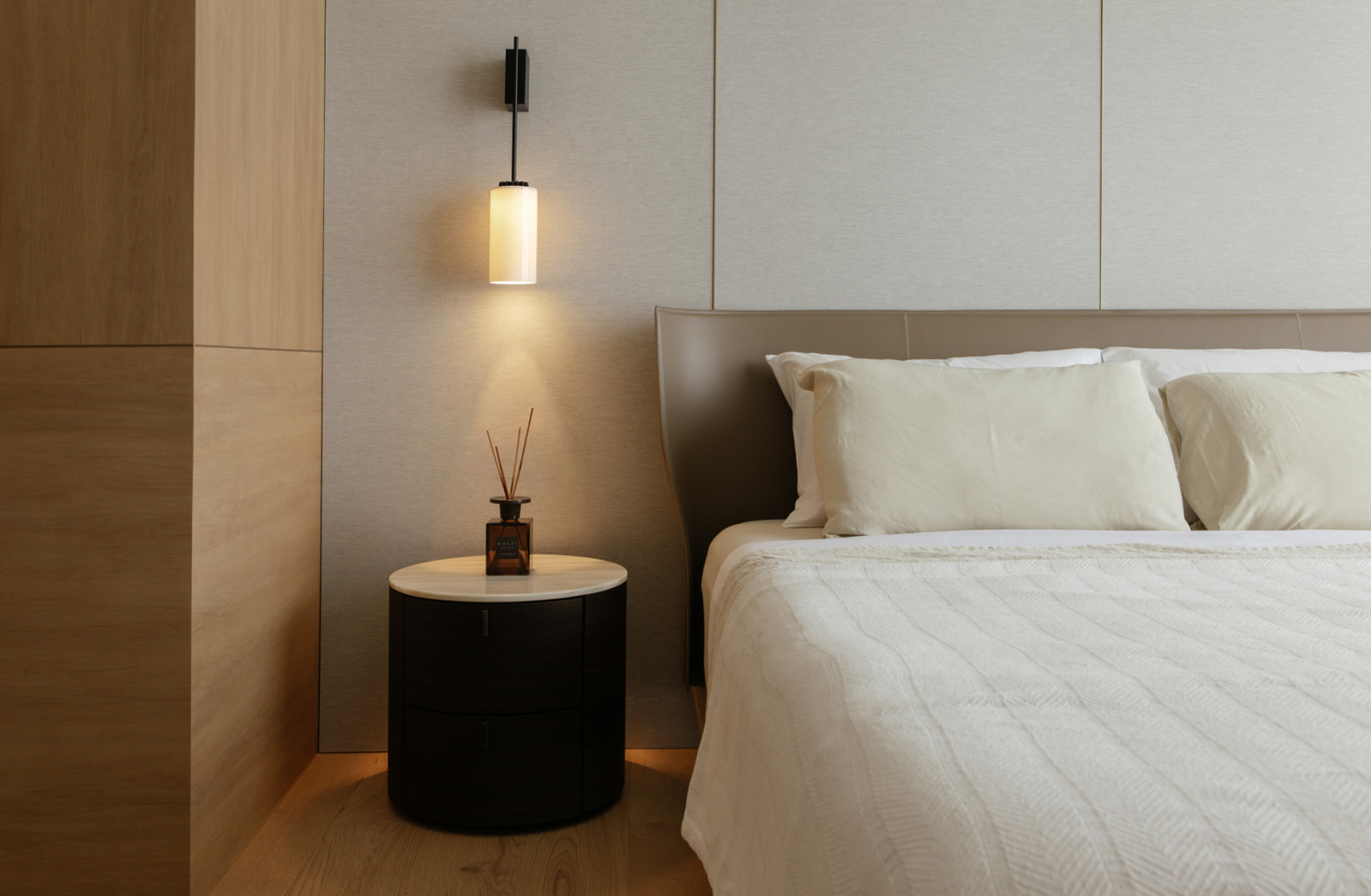 Ambient lighting in the bedroom adds warmth