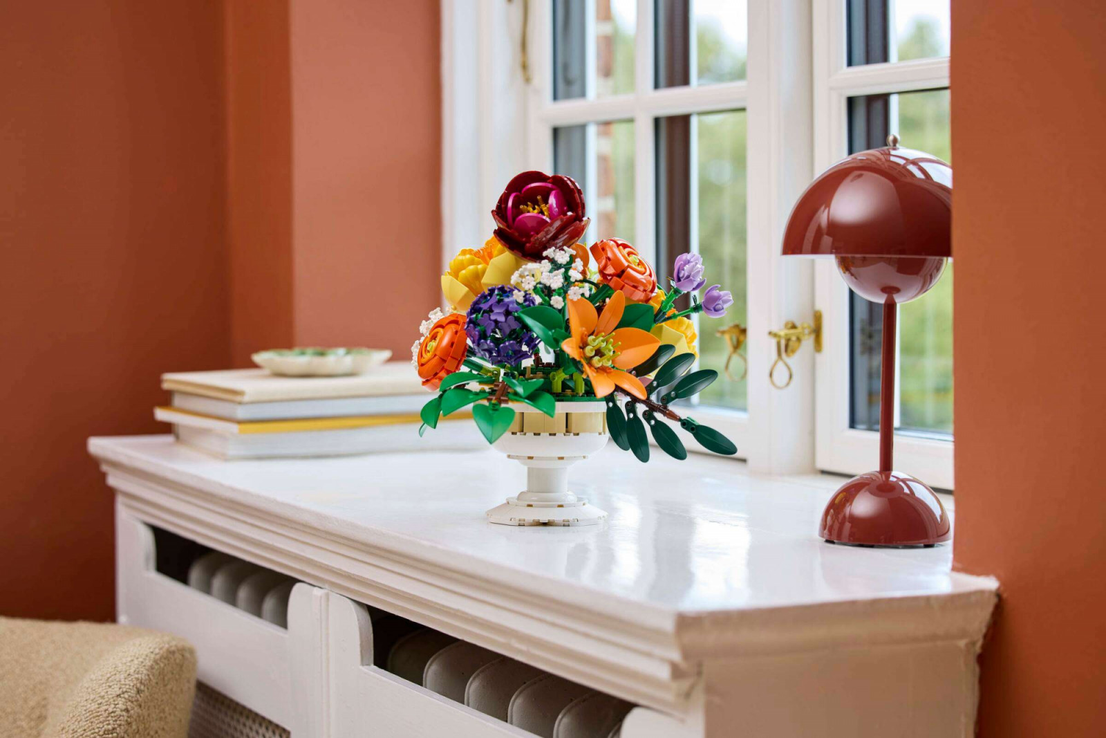 The Flower Arrangement measures 26 centimetres high and 31 centimetres wide, a scale that positions it comfortably alongside full-size decorative objects
